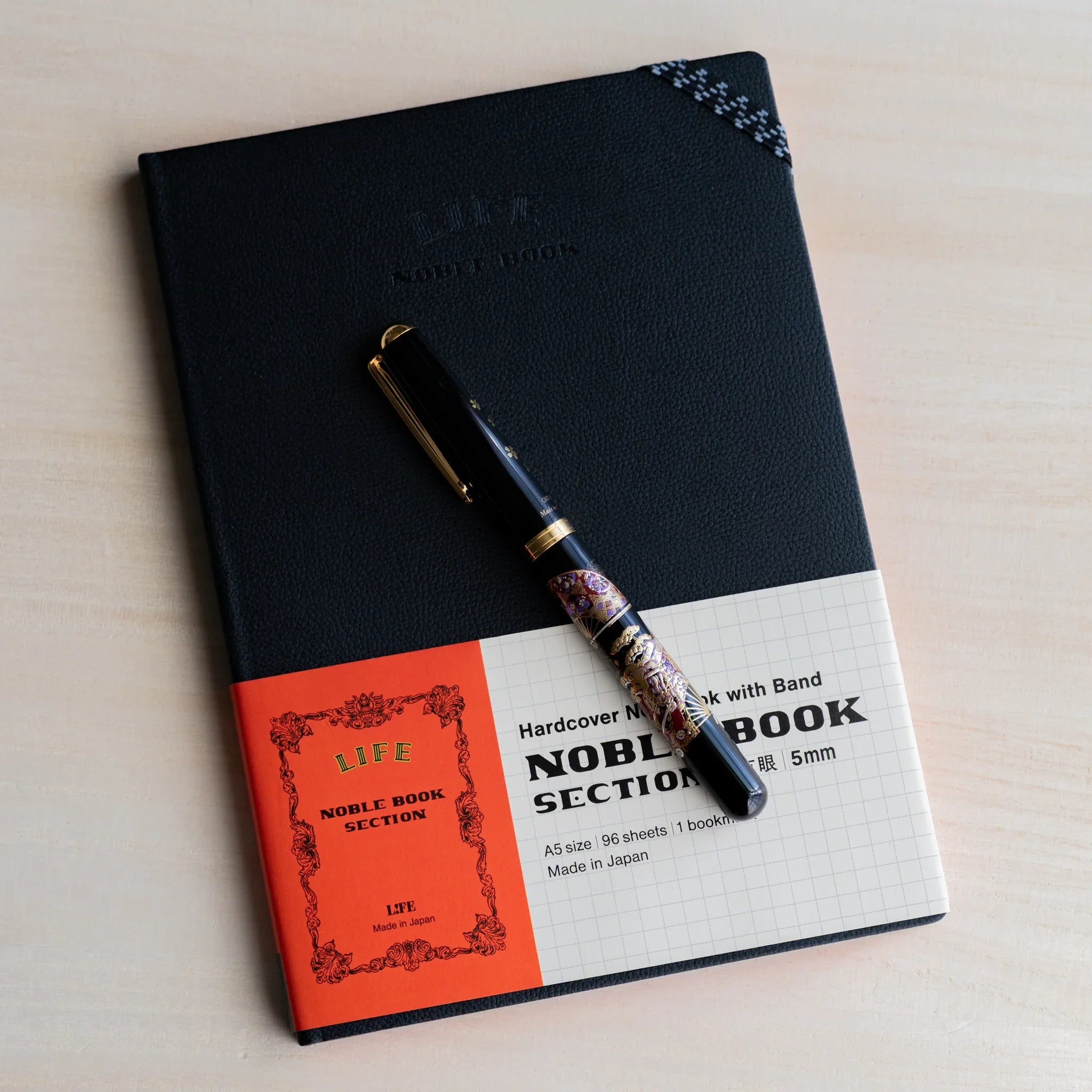 Life Noble A5 notebook, product photo hardcover design showing closure mechanism                              
