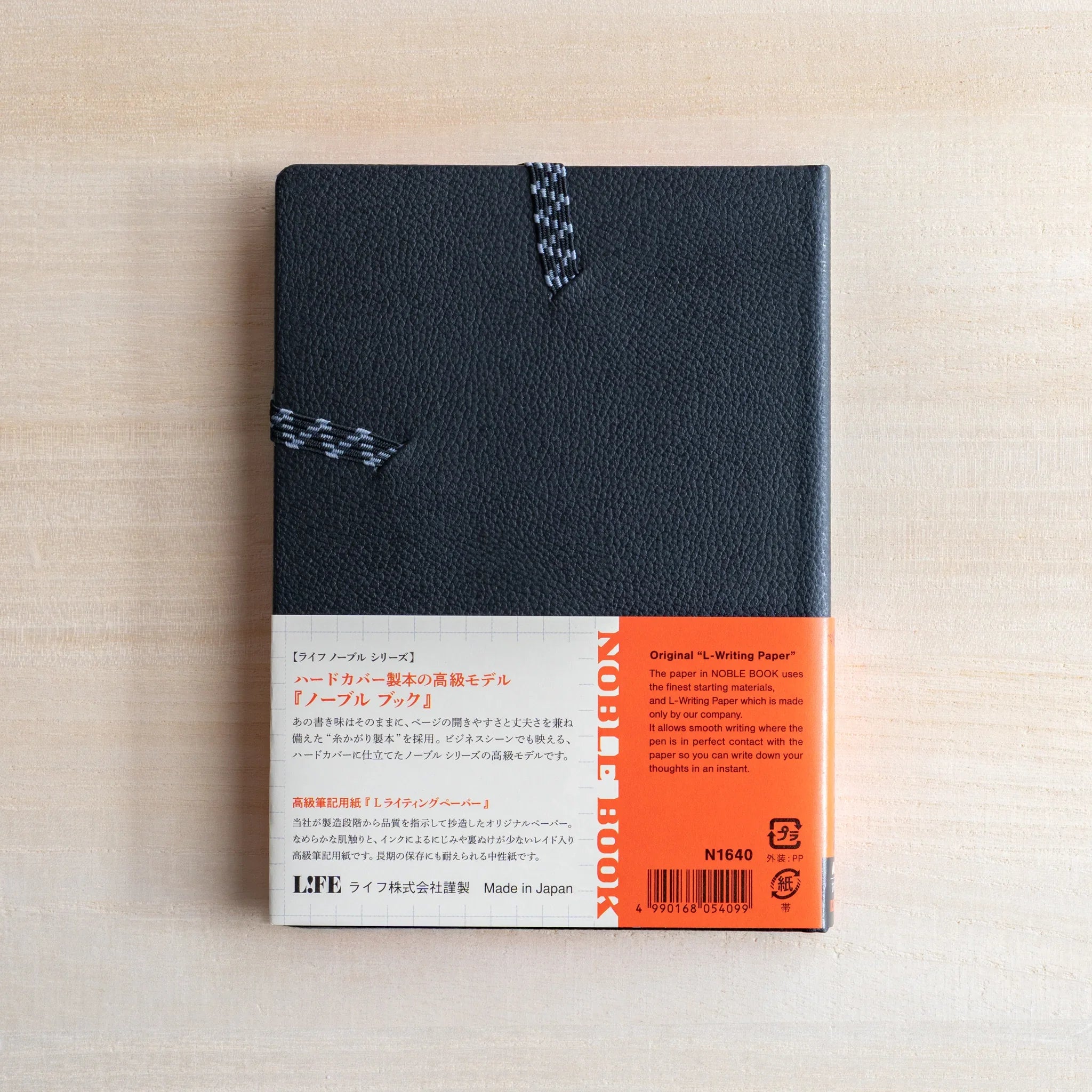Life Noble A6 notebook featuring leather cover, open view showing highlighting spine visible, LIFE Japan A6 hardcover noteboo