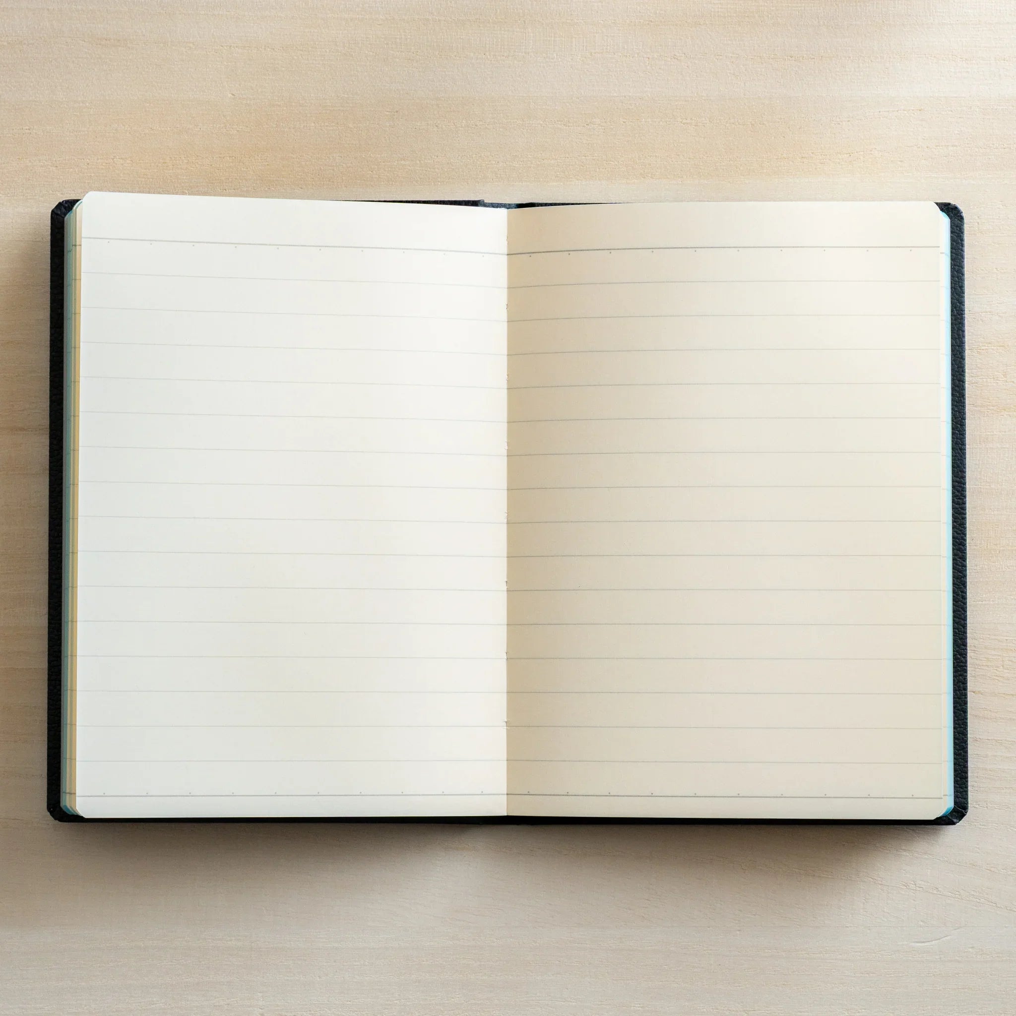 Life Noble A6 hardcover notebook featuring leather cover, closed front cover highlighting spine visible       