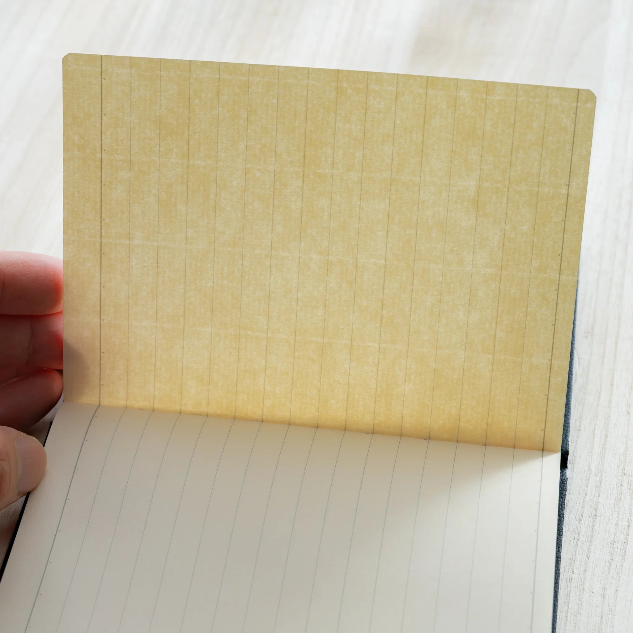 Life Noble A6 planning notebook featuring leather cover, closed front cover highlighting spine visible        