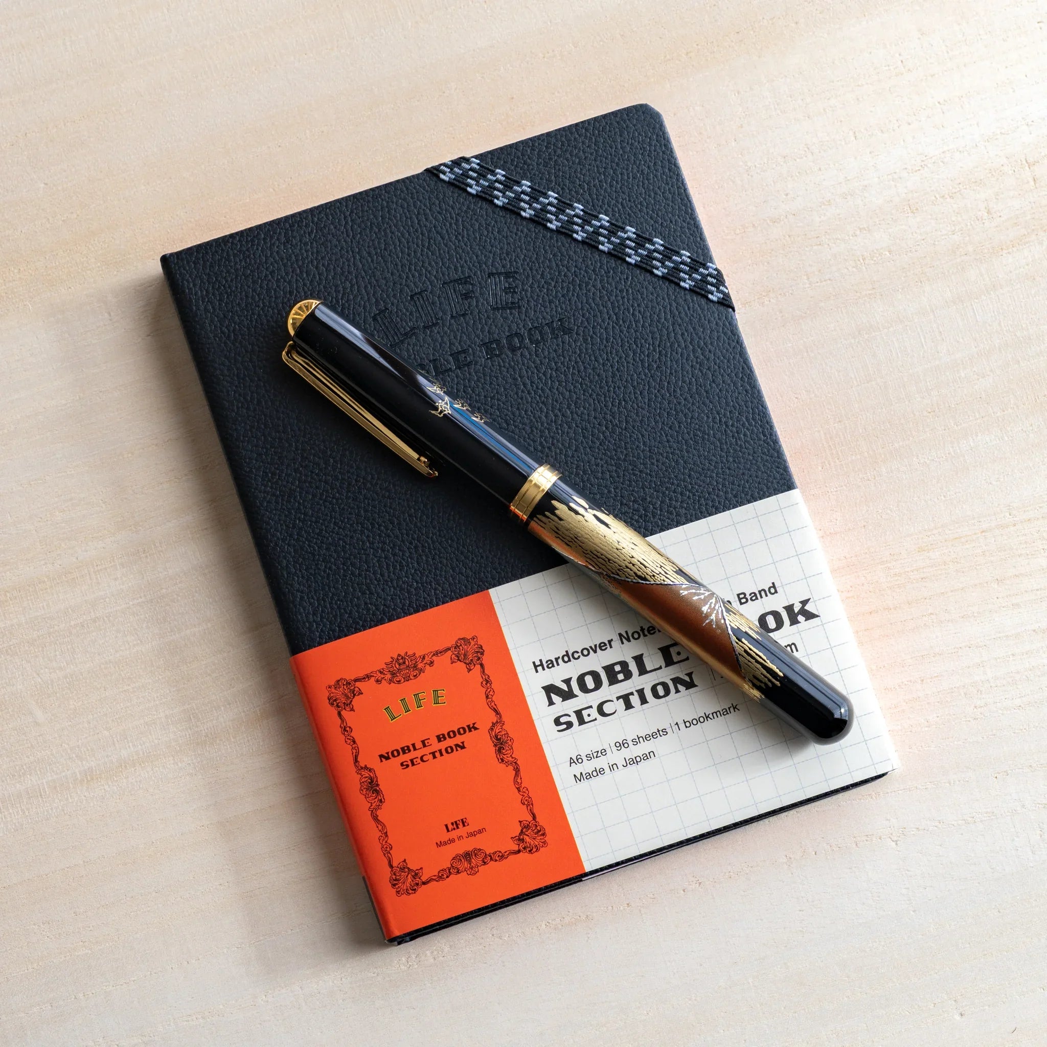 Life Noble A6 notebook, product photo hardcover design showing closure mechanism                              