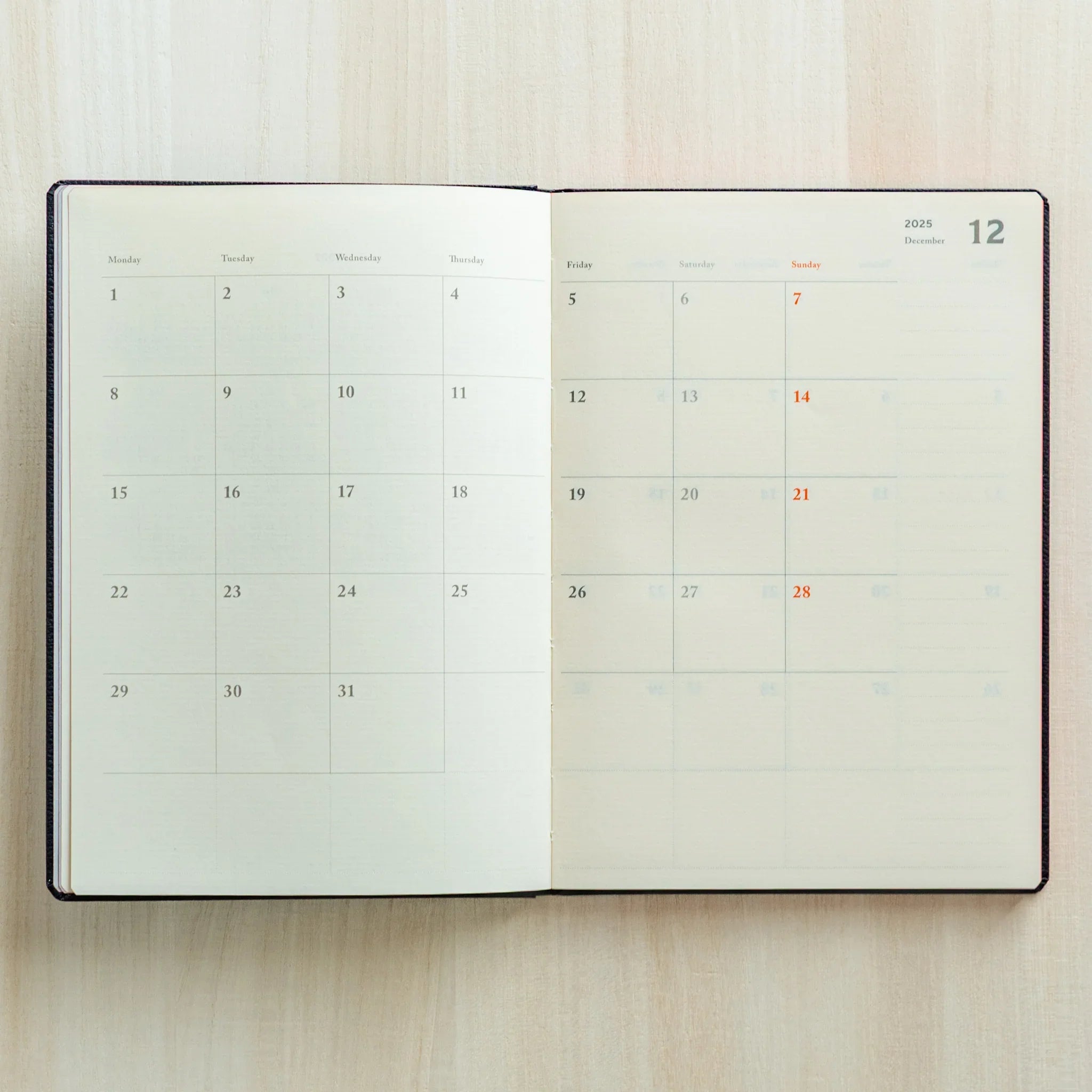 Life Noble 2026 schedule book in charcoal, closed cover showing with gold foil embossing                      