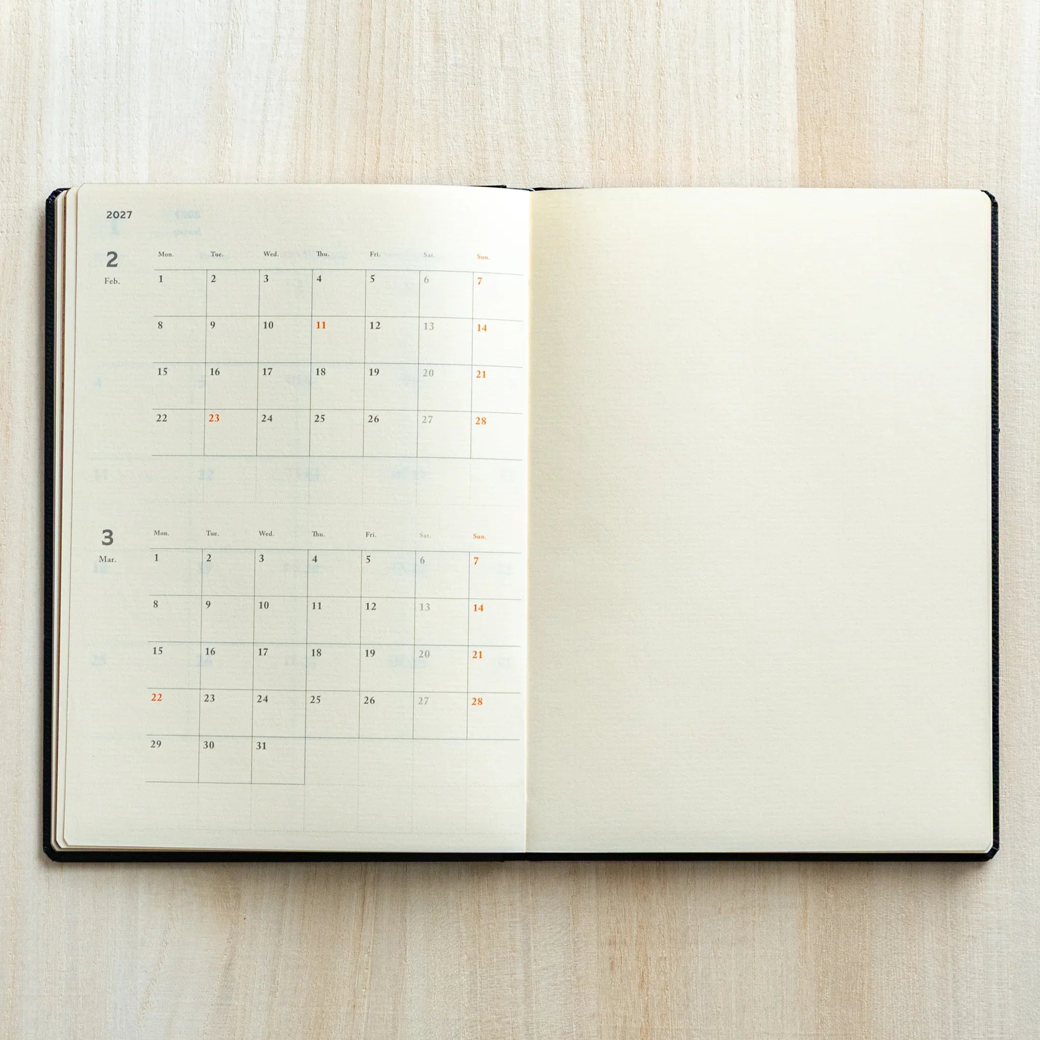 Life Noble 2026 hardcover planner in navy, flat lay display with embossed text                                