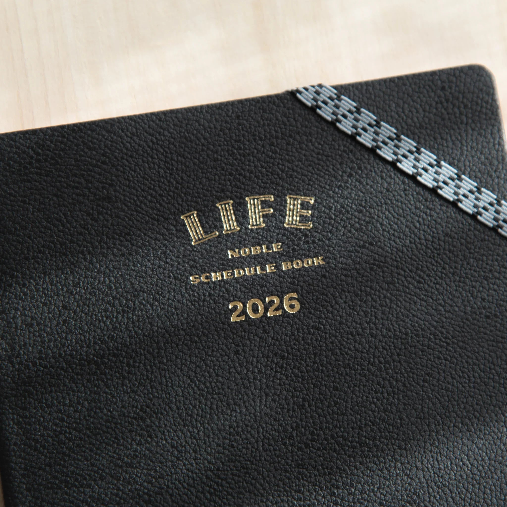 Life Noble planner for 2026 featuring navy, front cover view showing gold foil embossing                      
