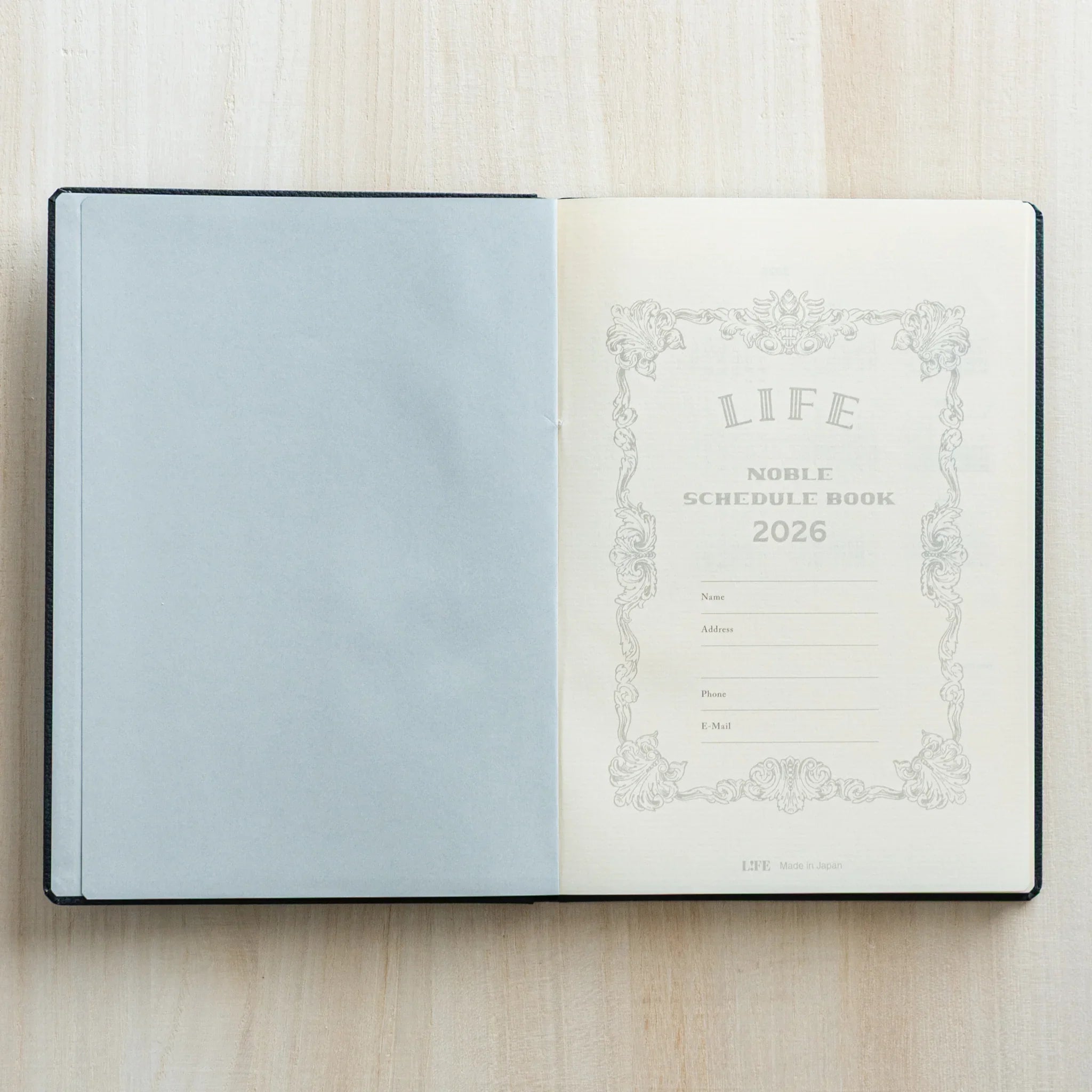 Life Noble planner for 2026, charcoal cover, product shot highlighting embossed text                          
