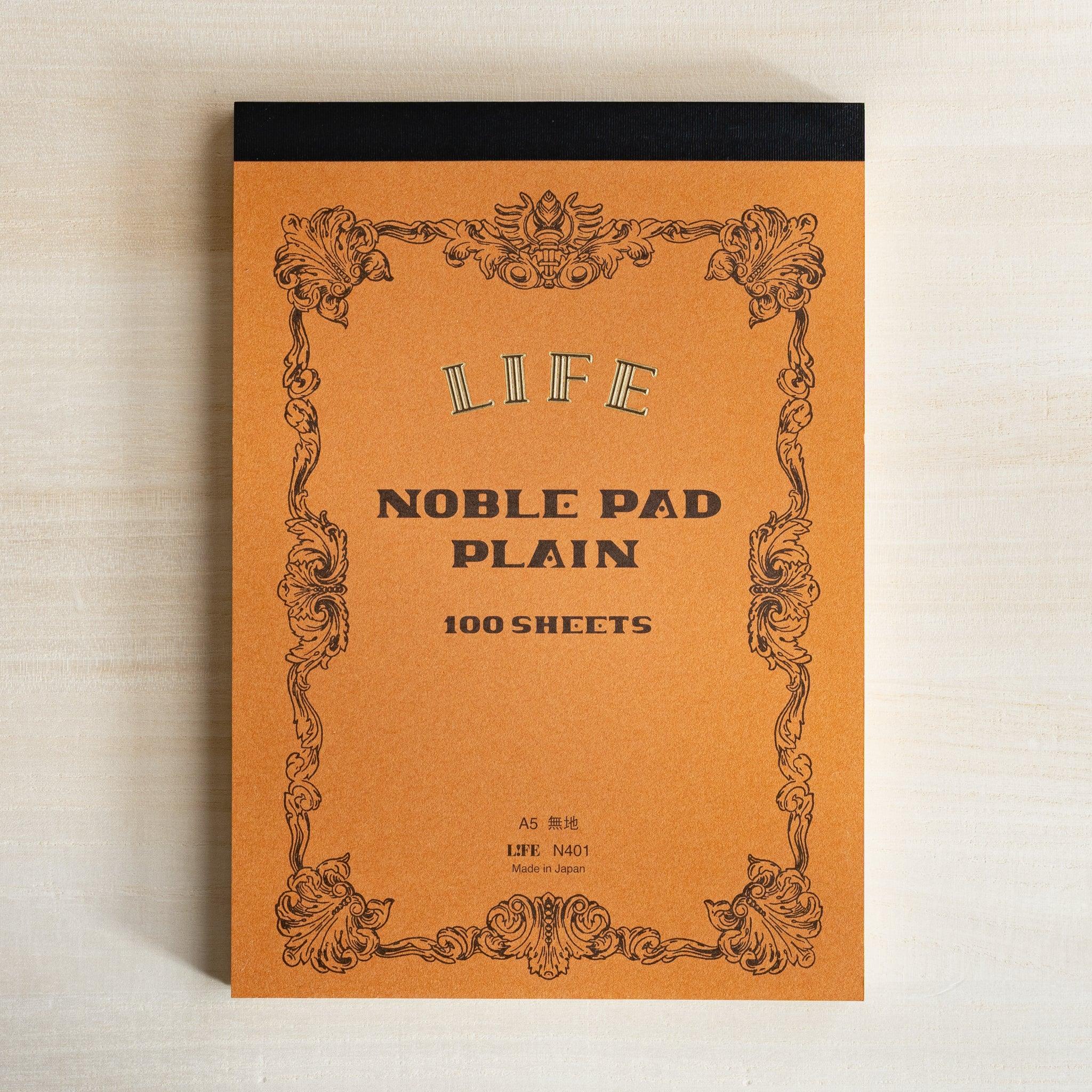 Life Noble A5 memo pad with decorative cover design, angled view showing demonstrating color options          
