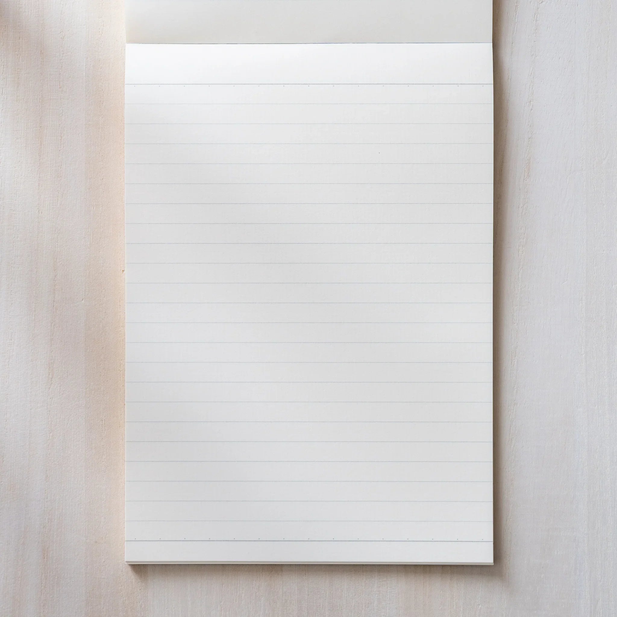 Life Noble A5 notepad, arranged view stylized cover highlighting paper quality                                