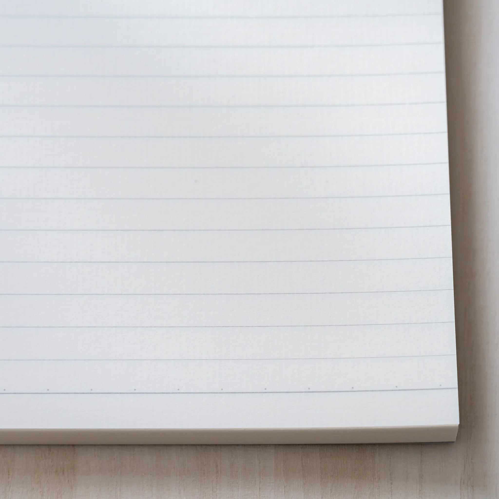 Life Noble A5 writing pad, angled view showing decorative pattern and binding detail                          
