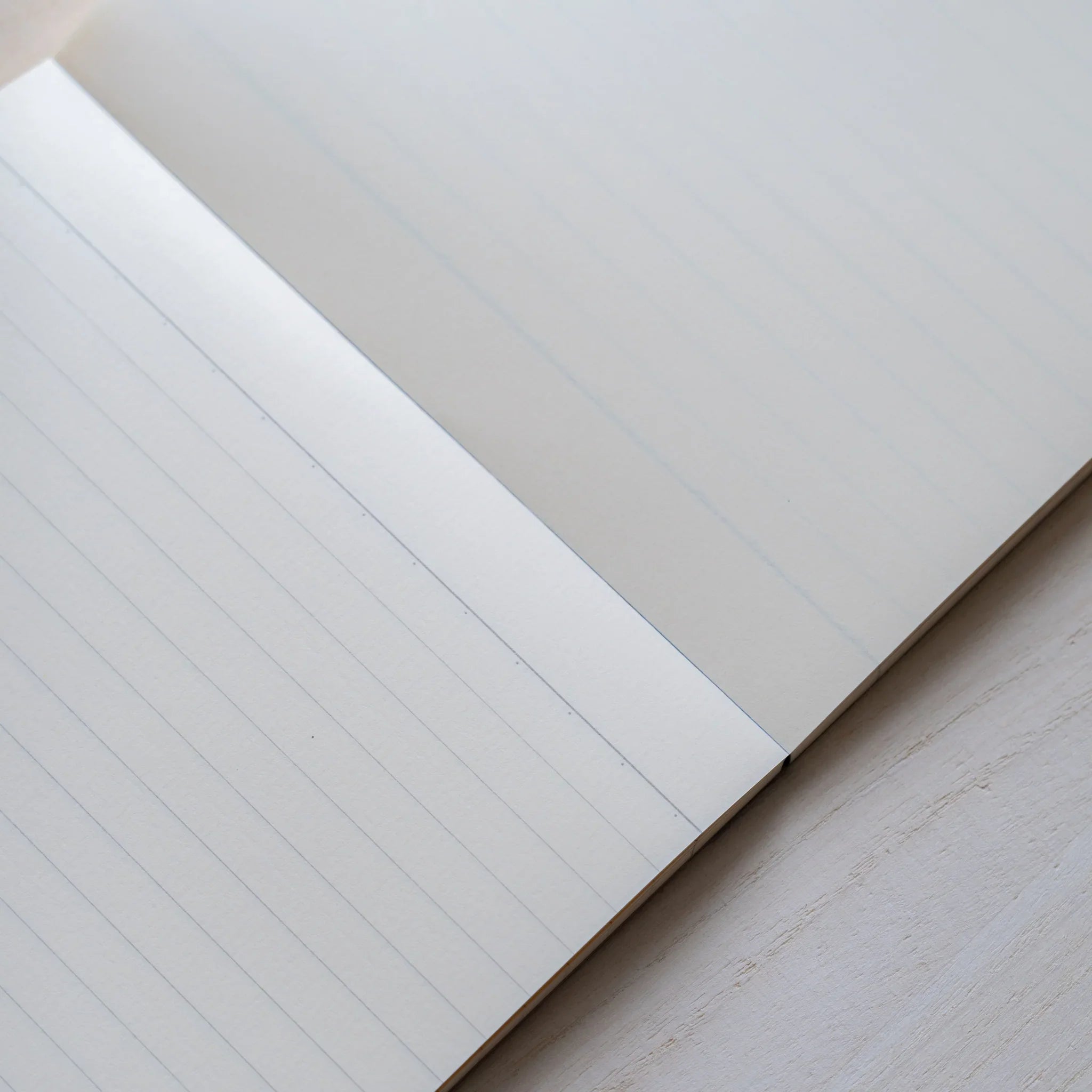 Life Noble A5 memo pad with decorative pattern, angled view showing demonstrating binding detail              