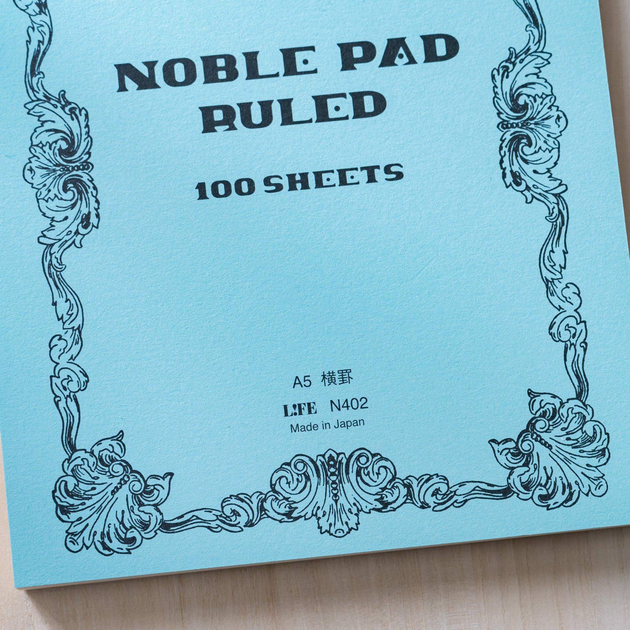 Life Noble A5 notepad, angled view showing decorative pattern and binding detail                              