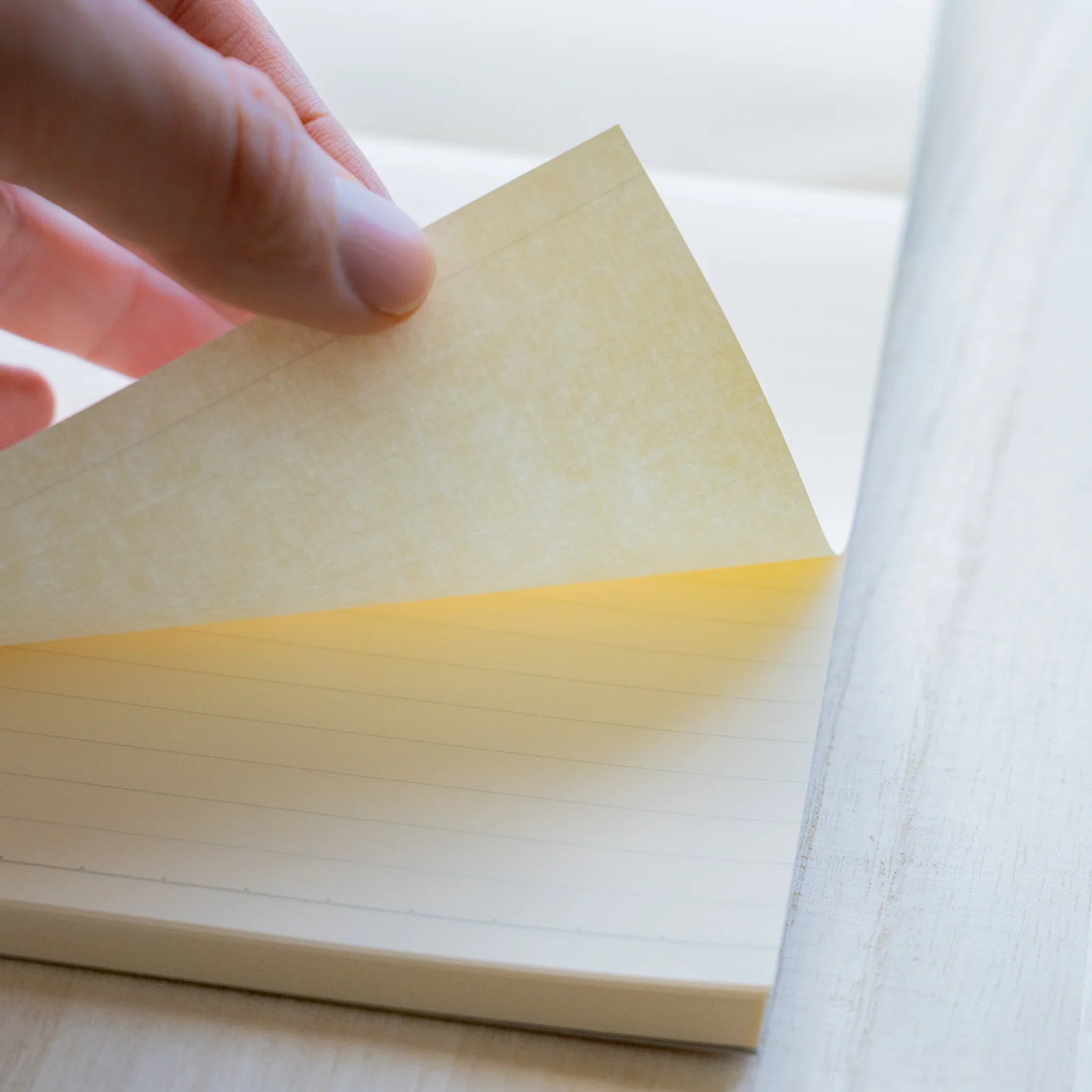 Life Noble B6 writing pad, angled view showing decorative pattern and binding detail                          