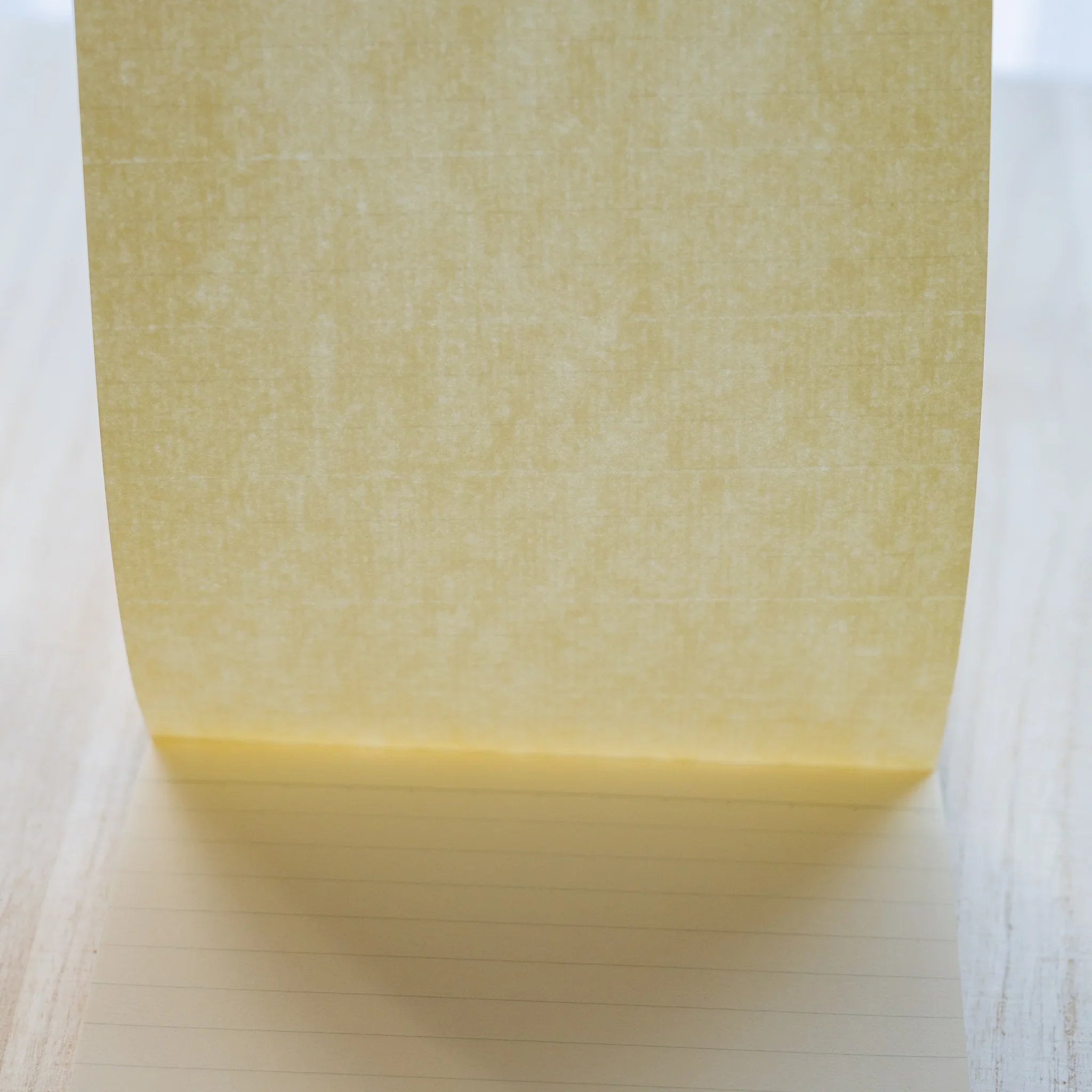 Life Noble B6 memo pad with decorative pattern, angled view showing demonstrating binding detail              