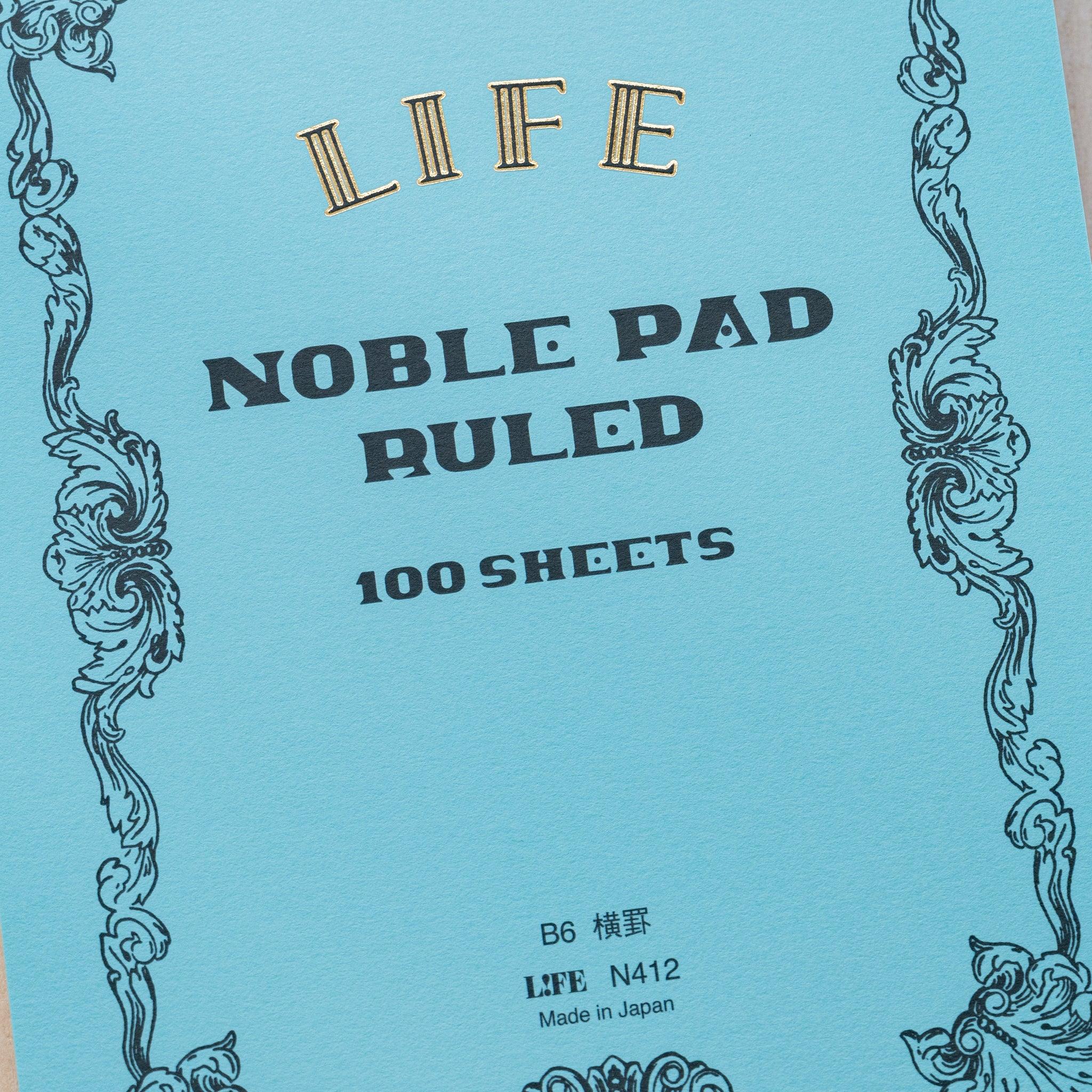Life Noble B6 notepad, angled view showing decorative pattern and binding detail                              