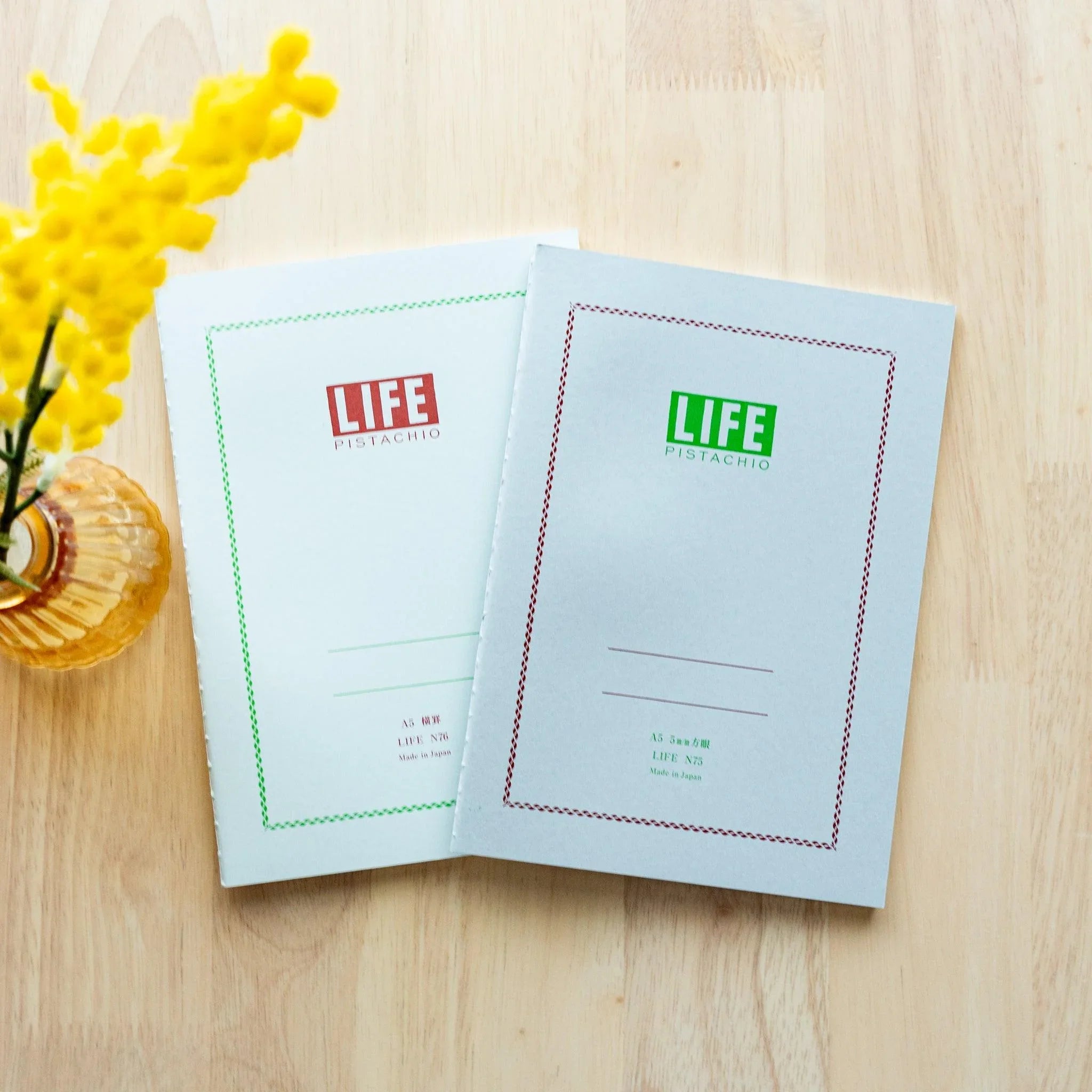LIFE Pistachio notebook with vibrant soft-green cover, front view with visible LIFE branding and logo