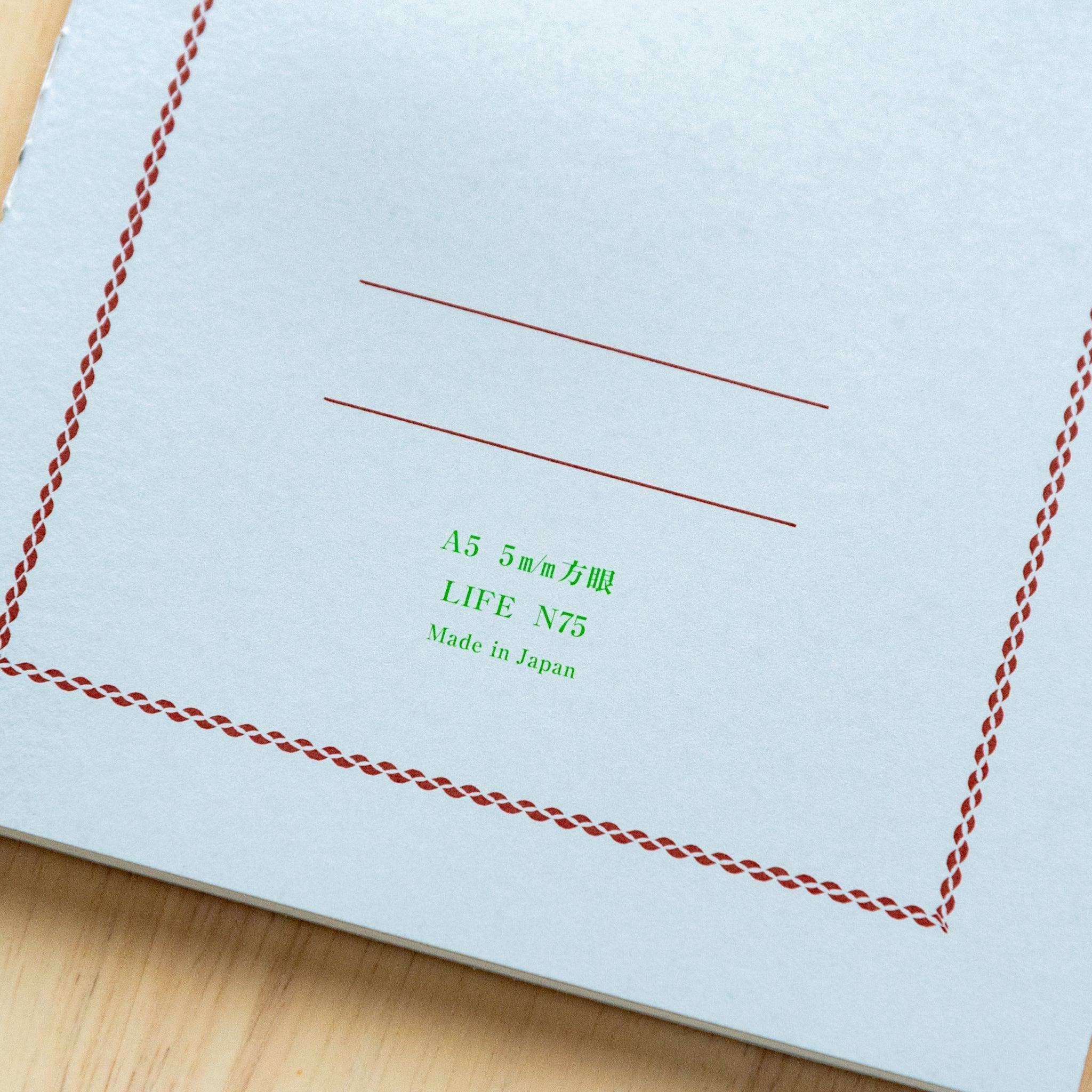 Pistachio green LIFE A5 journal with quality paper, fully opened pages revealing excellent paper quality