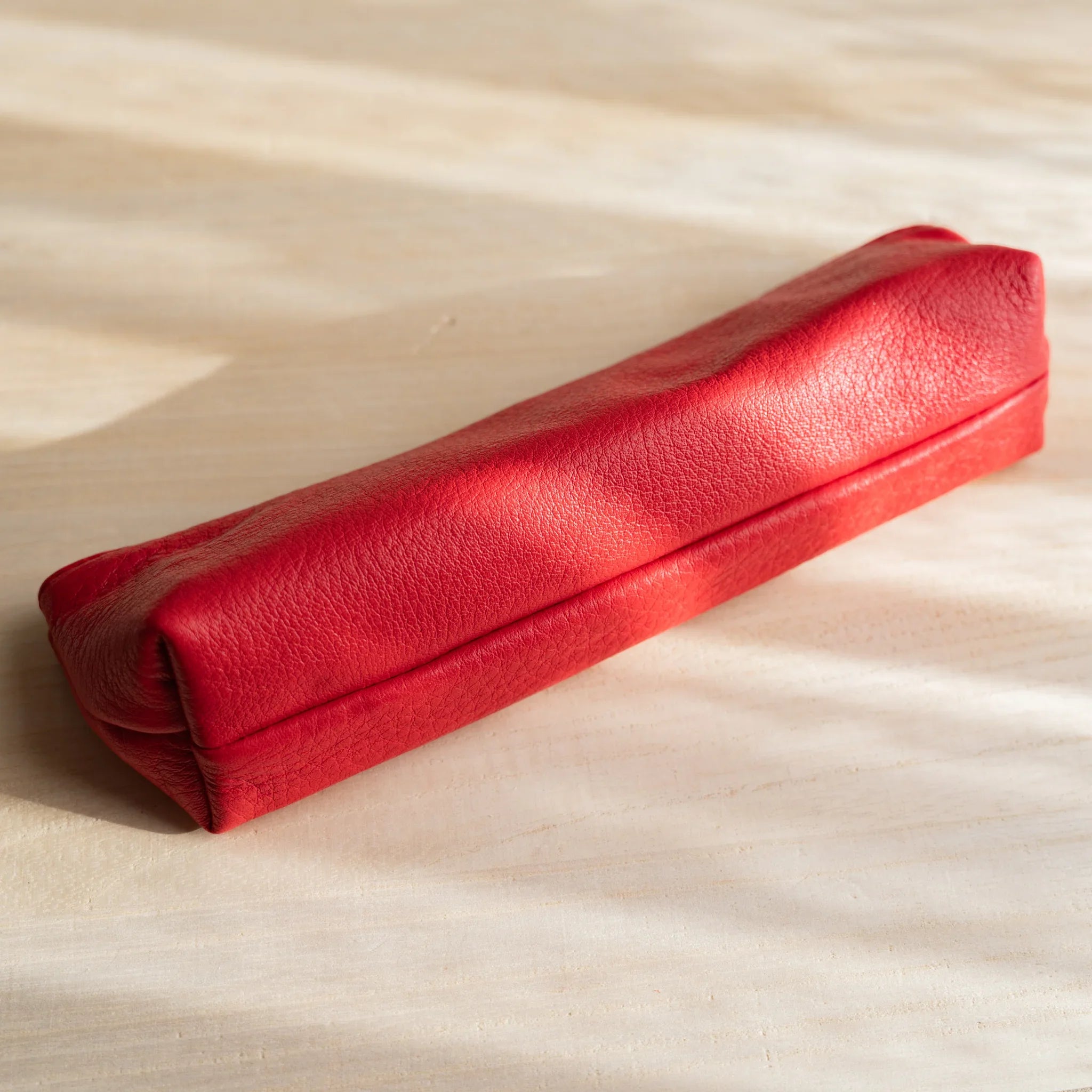 Red steerhide leather showing material texture and color and features and features and features and features