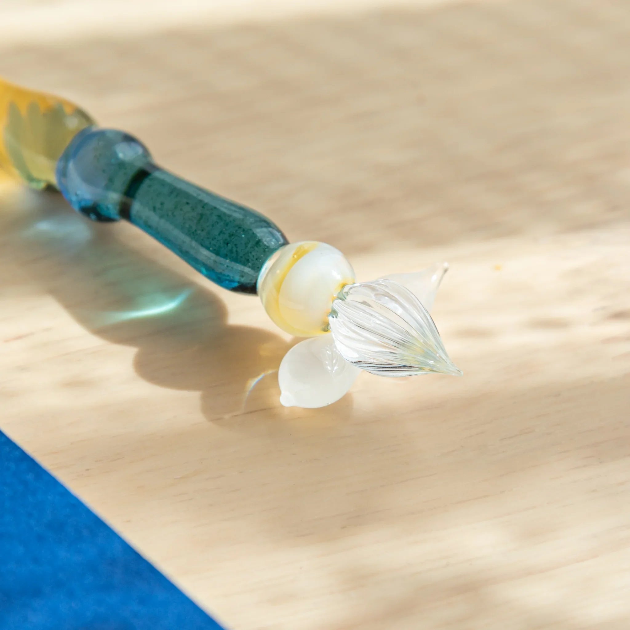 Lunar Glow iridescent glass dip pen with turquoise wrapped handle section and crescent moon-shaped rest detail