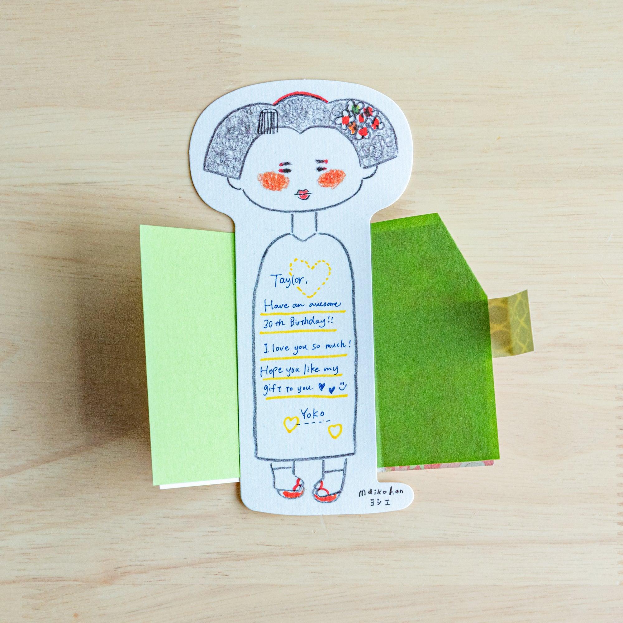 Open Maikohan Message Card with a handwritten birthday message inside, showing the yuzen washi wing panel and paper insert
