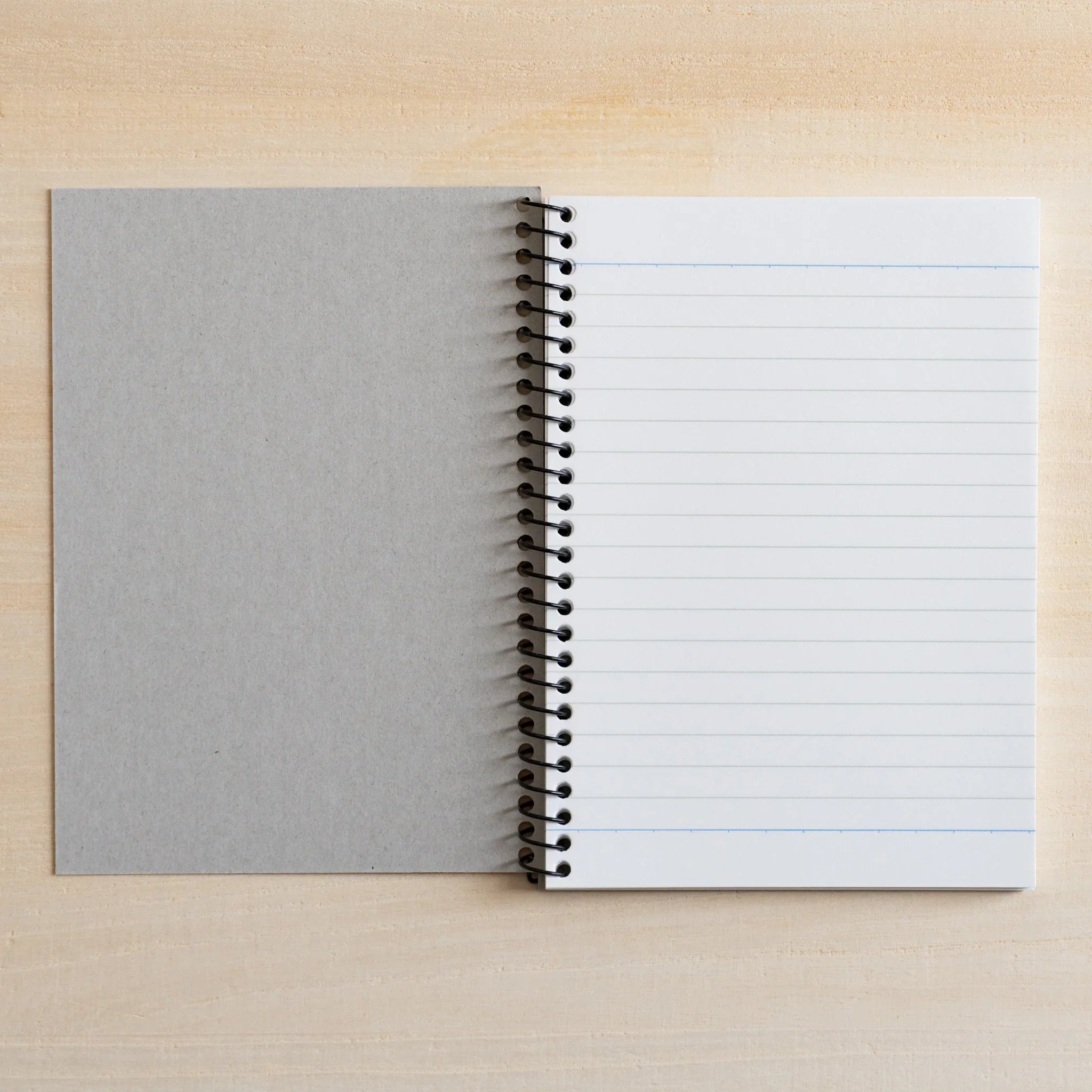 Maruman Zuan A6 notebook showing ring bound cover and metal binding detail                                    