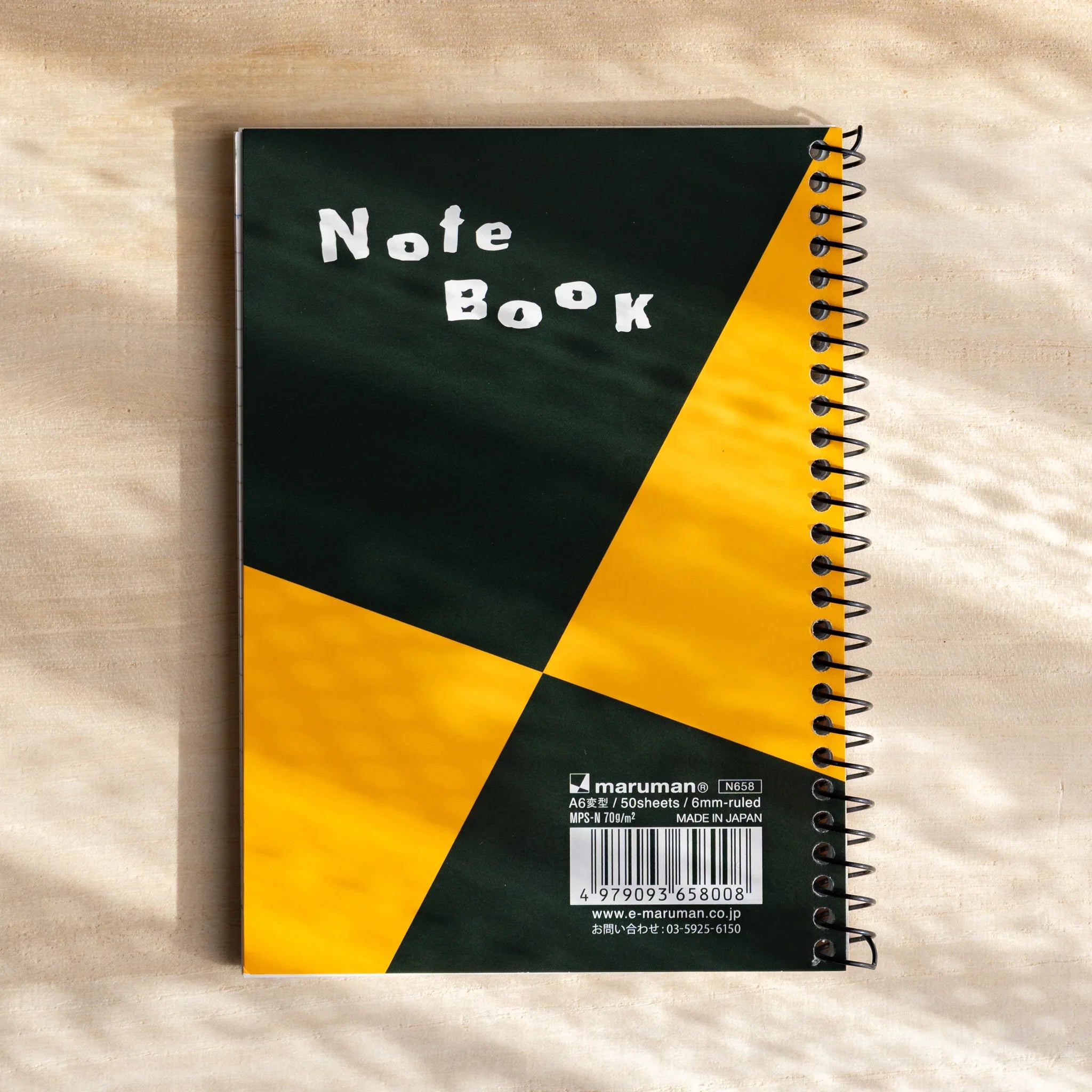 Maruman Zuan notebook A6 size showing full ring bound product with metal binding                              