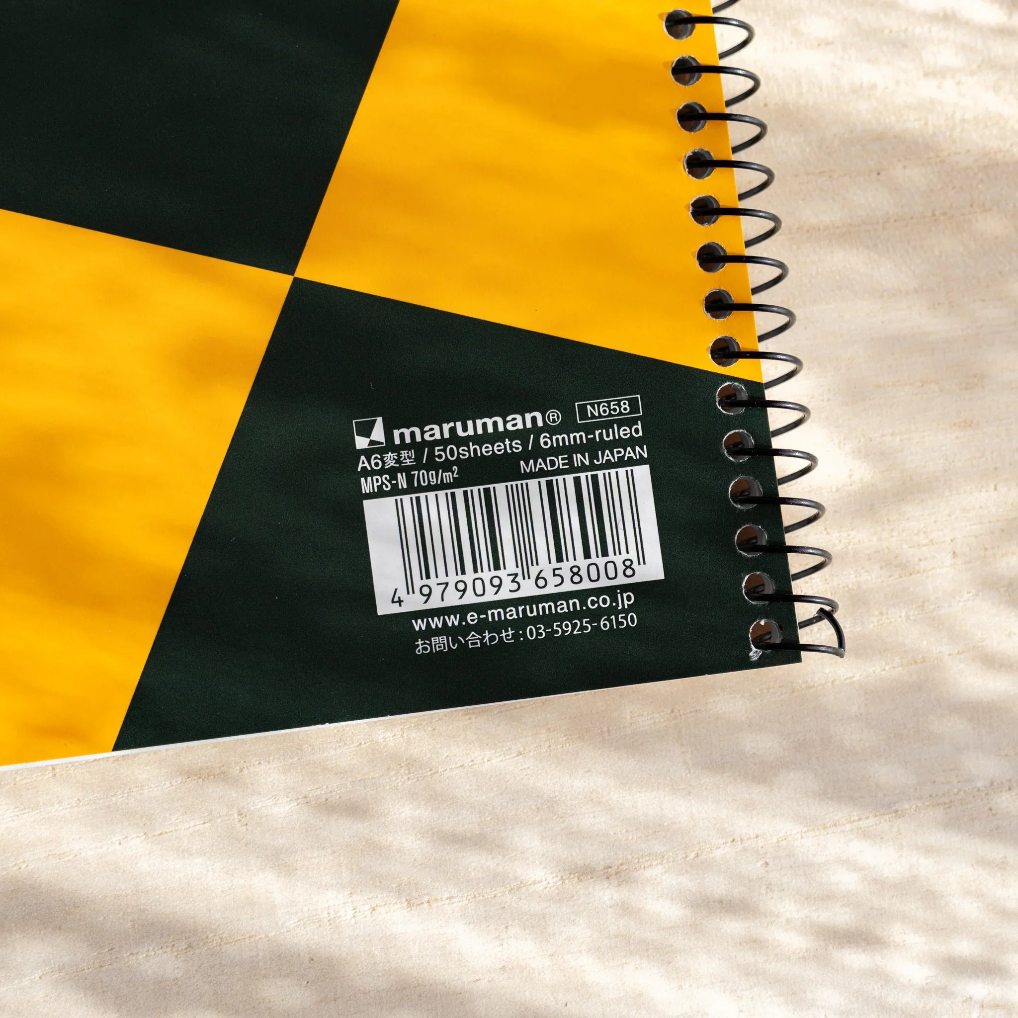 Maruman Zuan ring bound notebook detail showing metal binding and paper quality                               