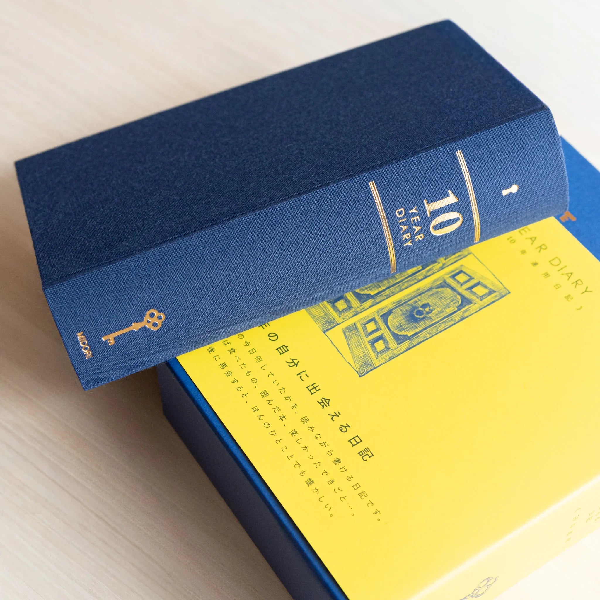 Midori 10-year journal, spread showing detailed page content with date sections, Japanese stationery with quality materials