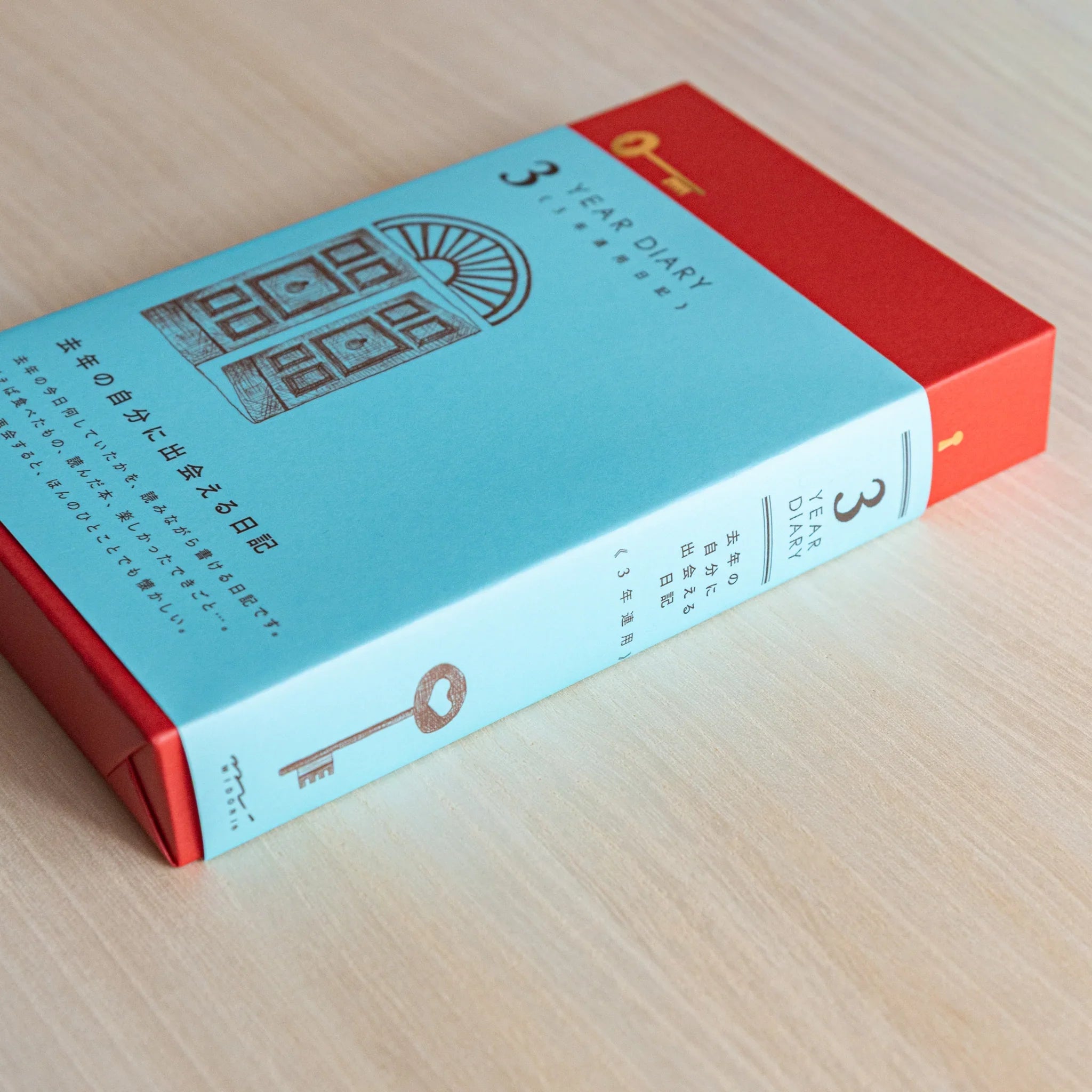 Midori 3-year journal, opened pages showing layout with year sections and dates, Midori 3-year journal with embossed cover