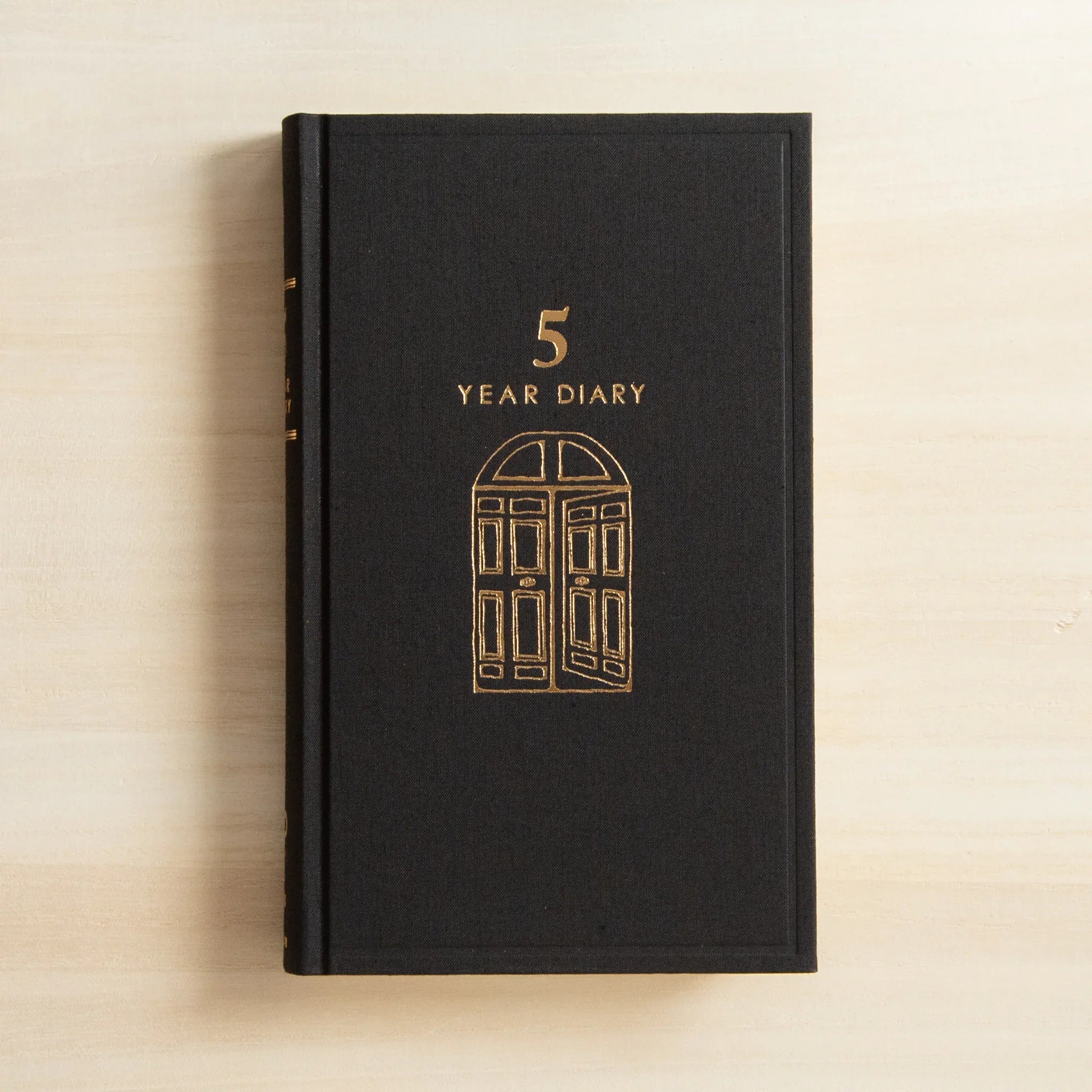 Midori 5-year journal, interior double-page spread with ruled lines visible, Japanese stationery product with quality design