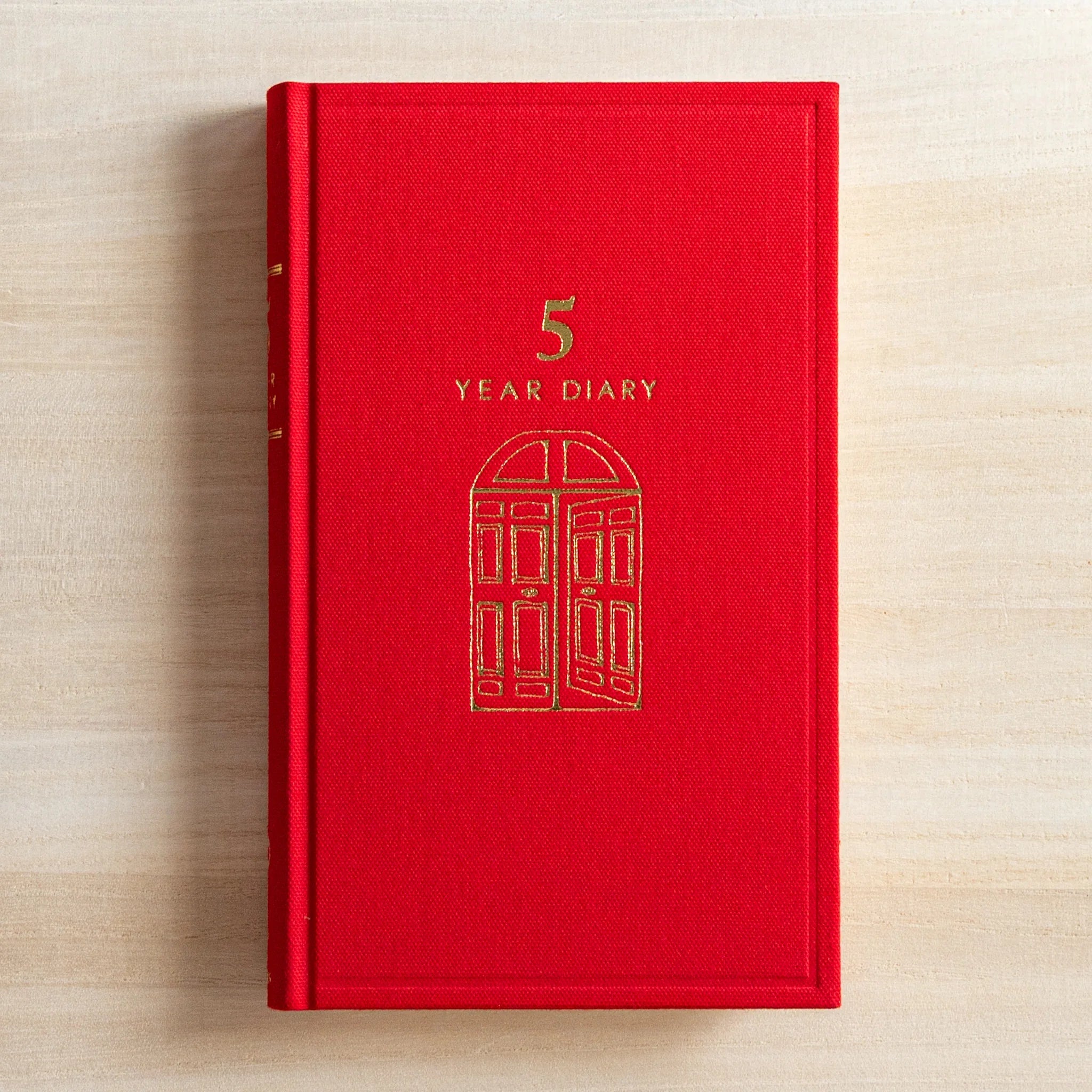 Midori 5-year journal, angled view showcasing cover texture and gate embossing, Japanese stationery product with quality