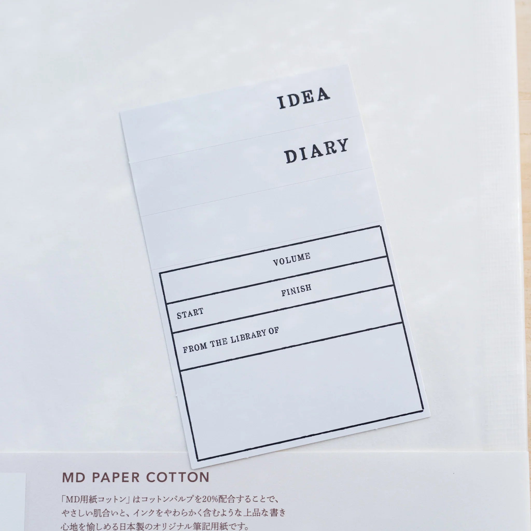 Included Midori MD Notebook sticker label sheet printed with IDEA, DIARY and a bookplate, on the cotton back cover