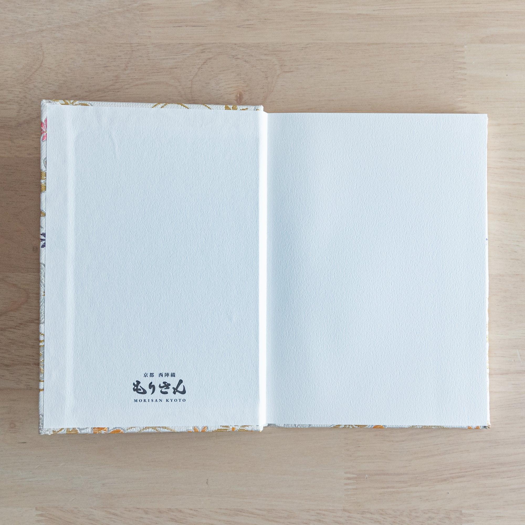 Nishijin textile B6 journal, fully opened showing quality paper and floral brocade textile with binding