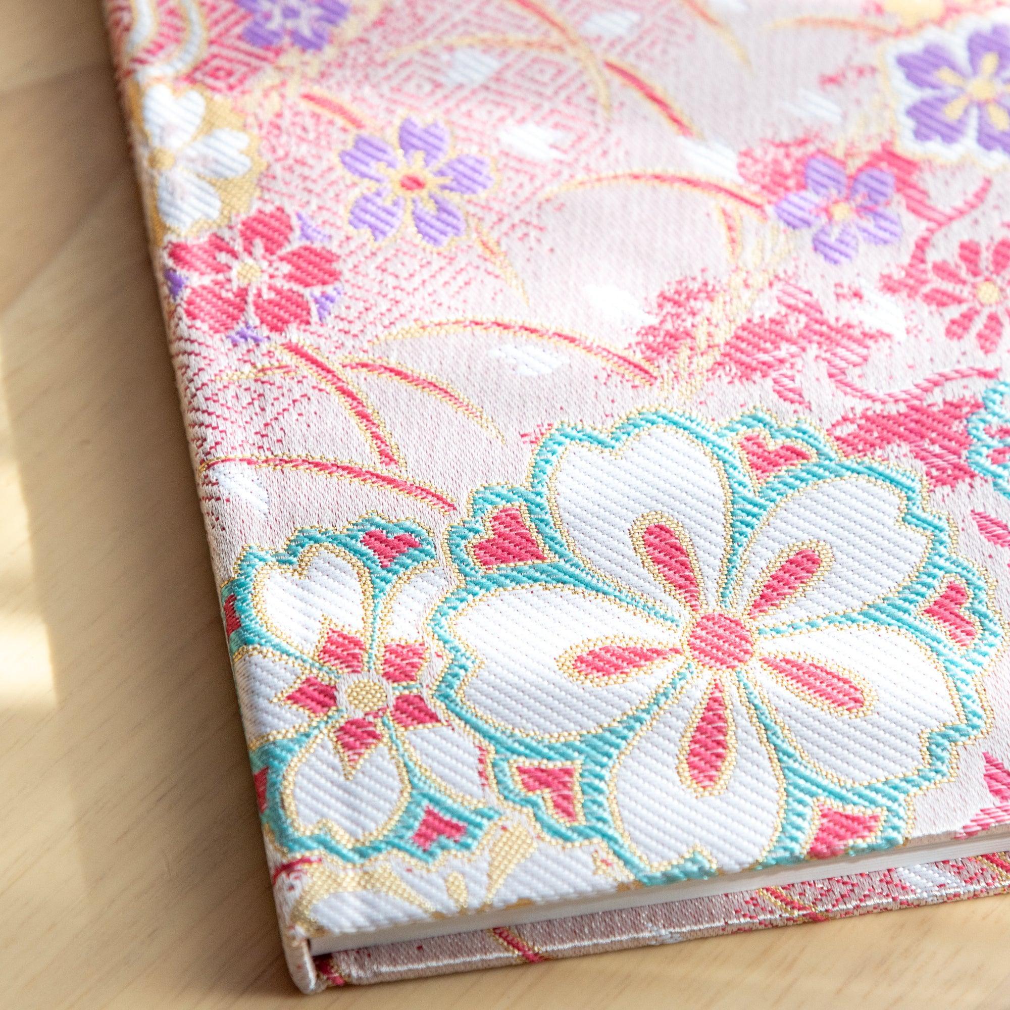 Nishijin textile B6 journal, fully opened showing quality paper and sakura cherry brocade with binding