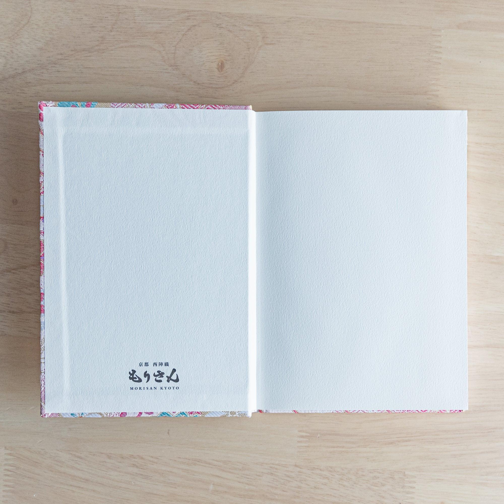 Nishijin textile B6 notebook, flat lay of traditional Sakura Brocade cherry blossom design with binding