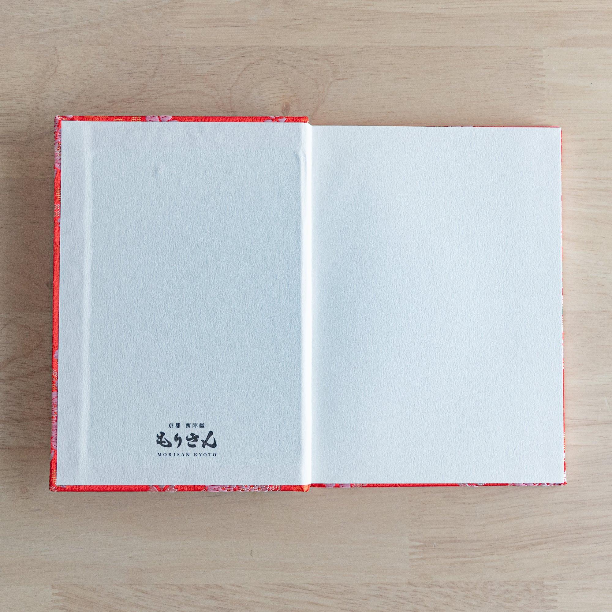 Nishijin textile B6 journal, fully opened showing quality paper and floral ensemble brocade with binding