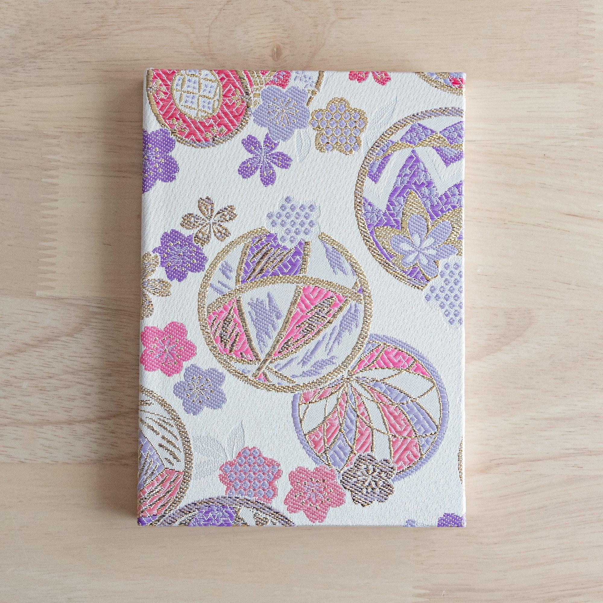 Nishijin textile B6 journal, fully opened showing quality paper and traditional Temari brocade with binding