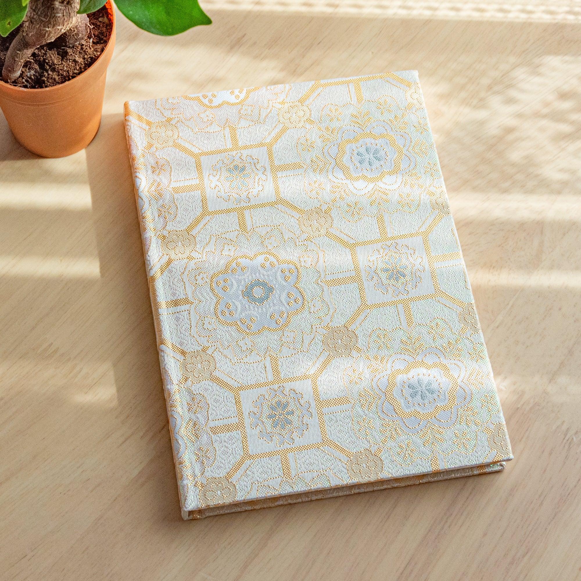 Nishijin textile B6 notebook with traditional brocade Shokkou Pattern front cover design detail with binding