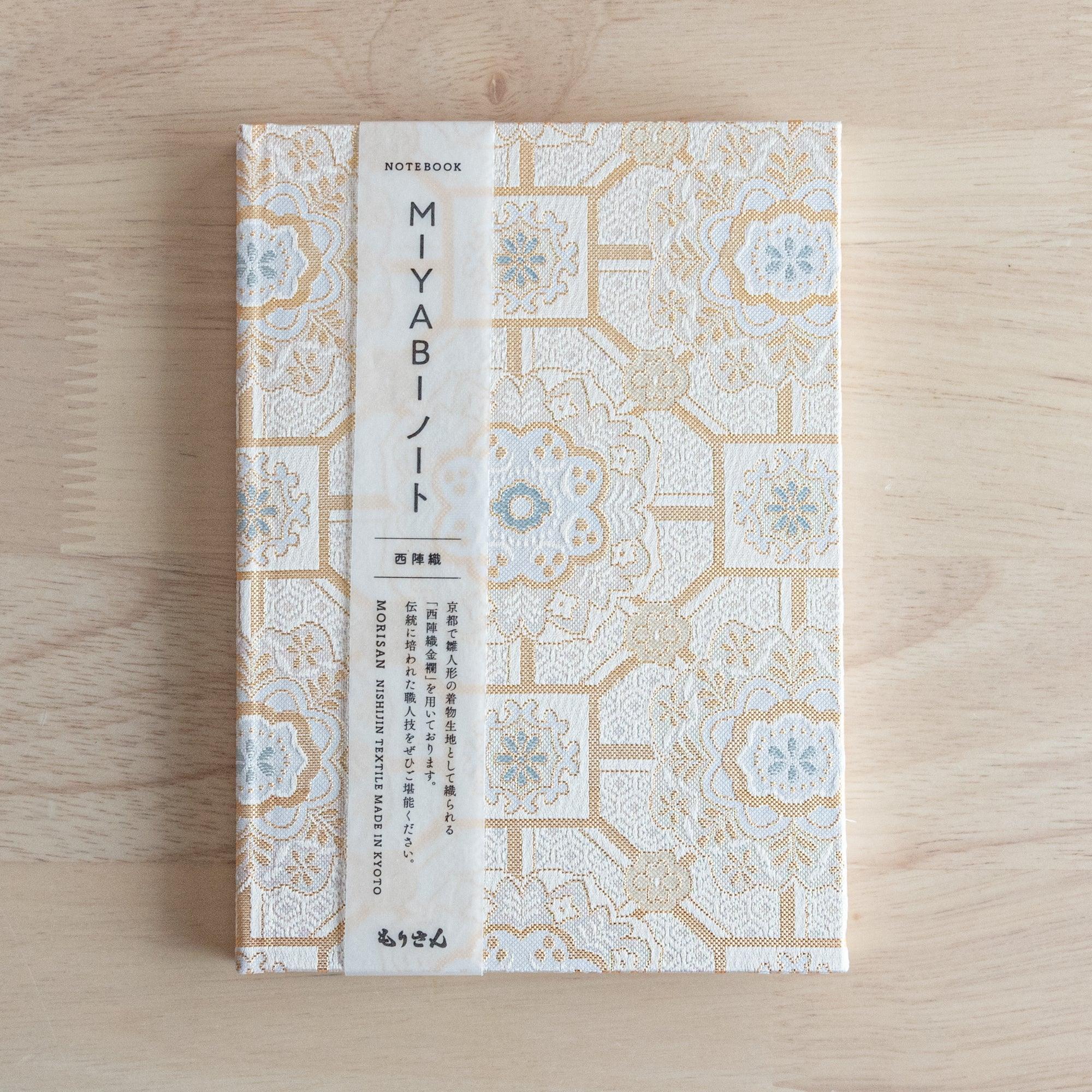 Japanese Nishijin textile B6, angled shot of traditional brocade Shokkou pattern design with binding