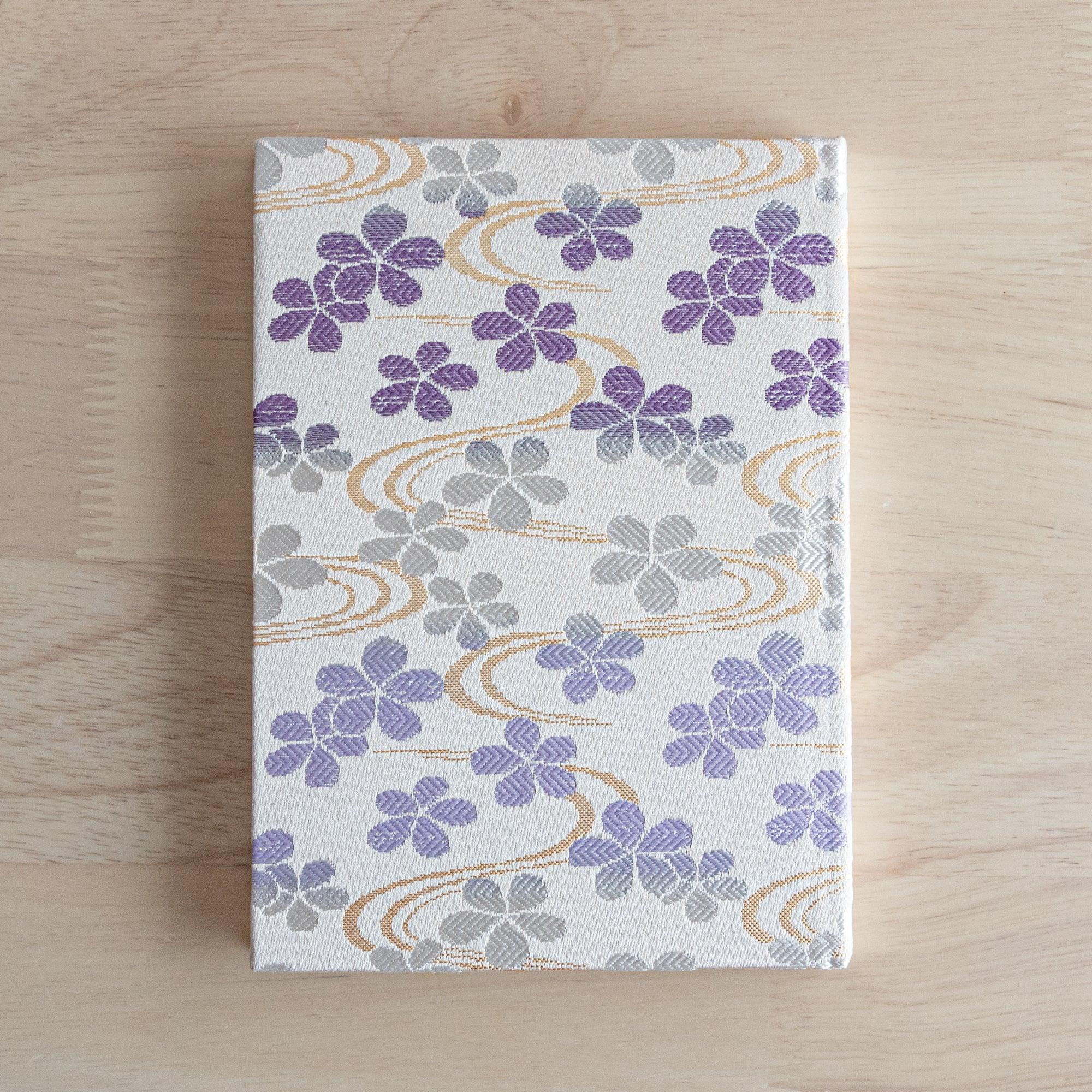 Nishijin textile B6 notebook, flat lay of Streamside Sakura brocade design with detail with quality binding
