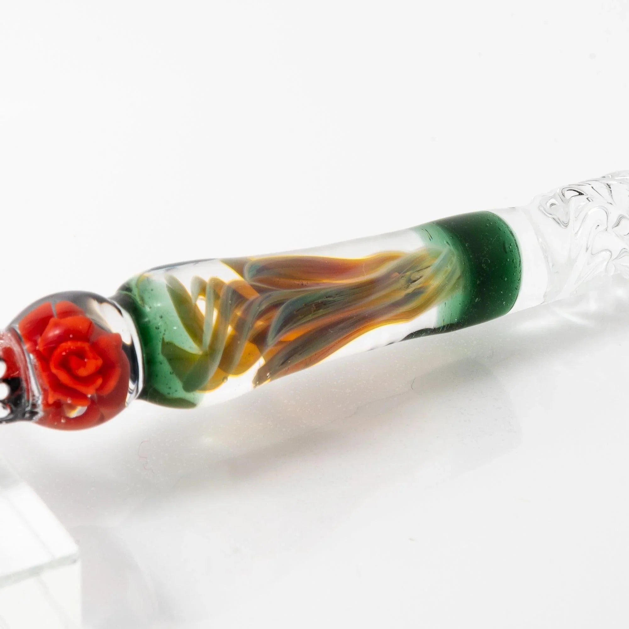 Close-up detail of Orange Rose glass dip pen nib showing intricate metal work and writing edge precision with holder