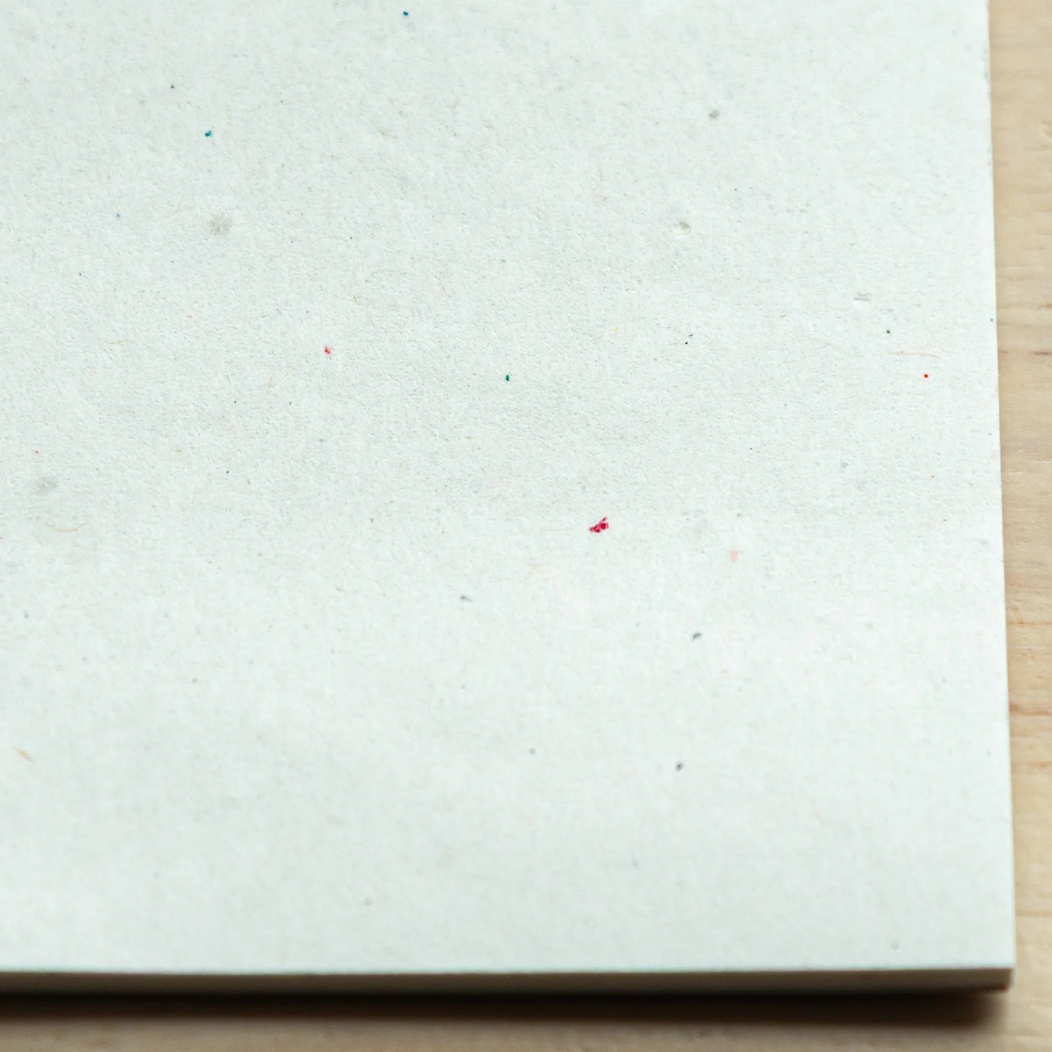 Washi paper samples showing light transmission properties and visible natural fiber content found throughout pages