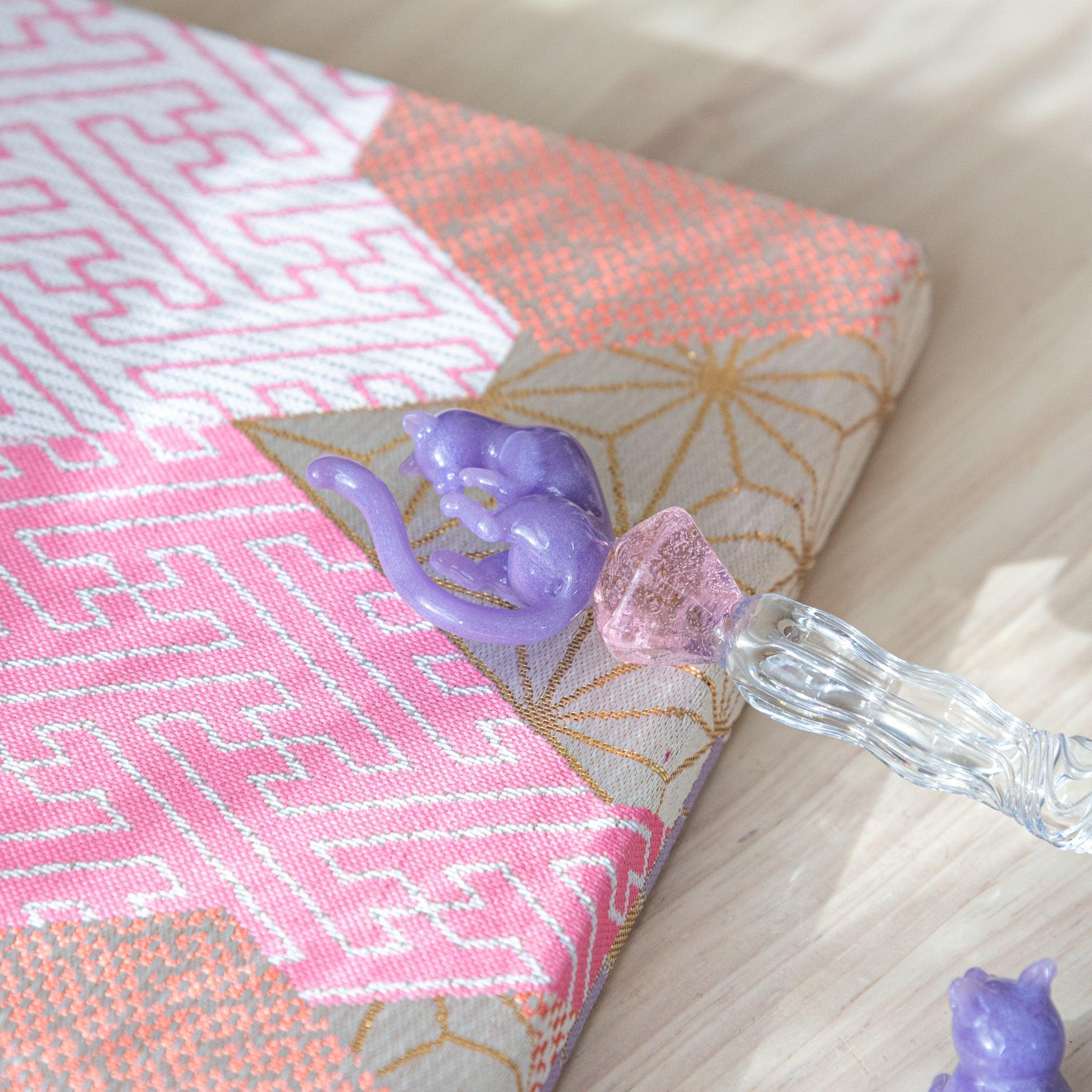 Japanese glass dip pen in soft pastel purple color featuring cat ear details and charming feline-inspired craftsmanship