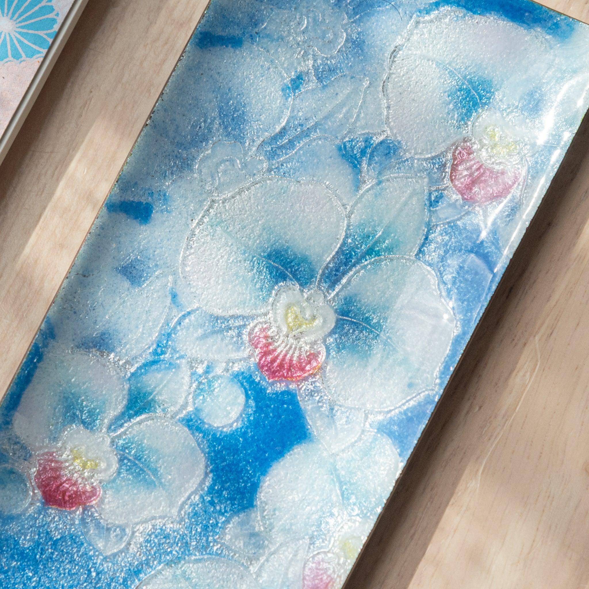 Phalaenopsis orchid shippo ware pen tray showing detailed floral motif from above in vibrant cloisonne colors lie