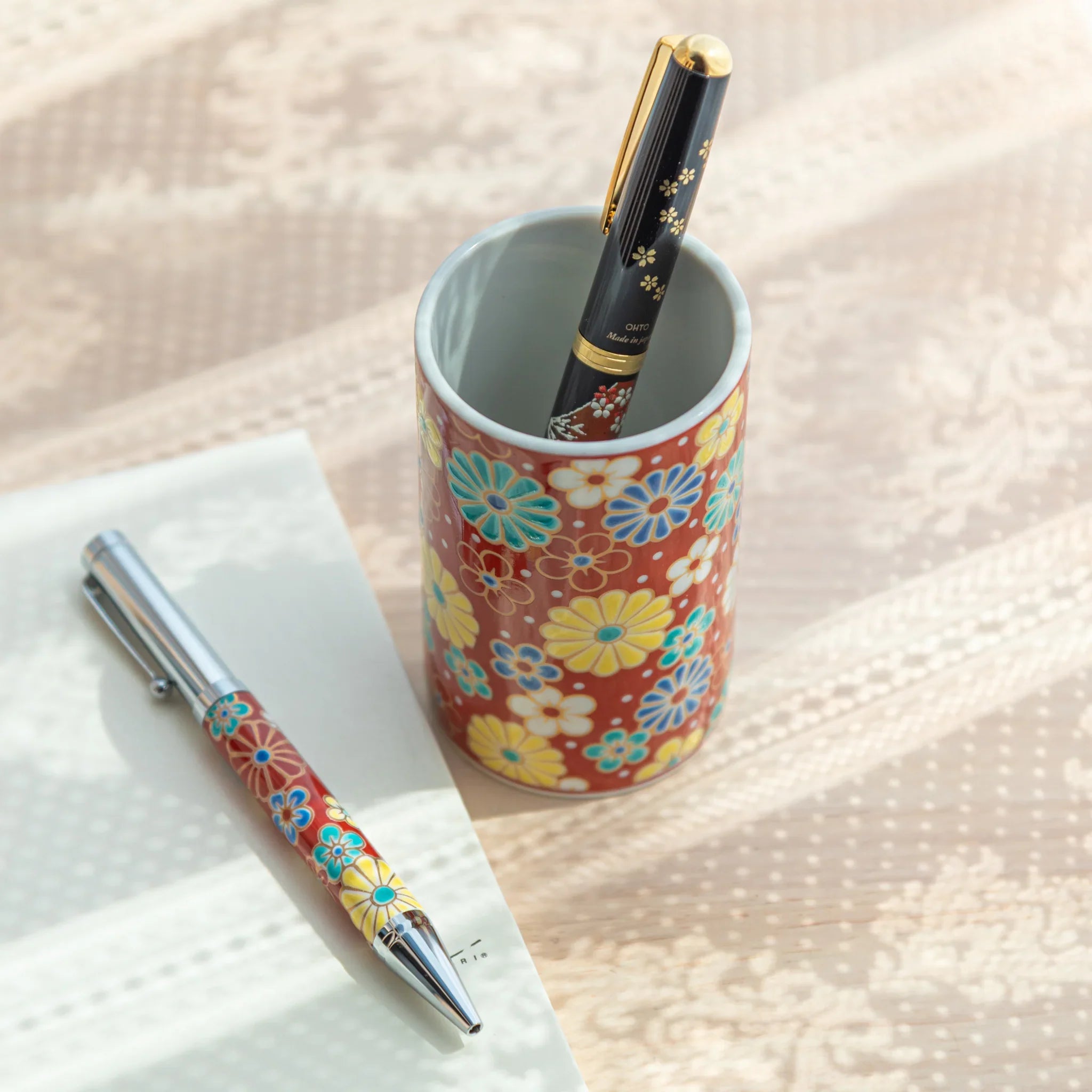 Japanese floral Kutani ceramic pen holder bringing artistic plum and chrysanthemum design featuring traditional porcelain