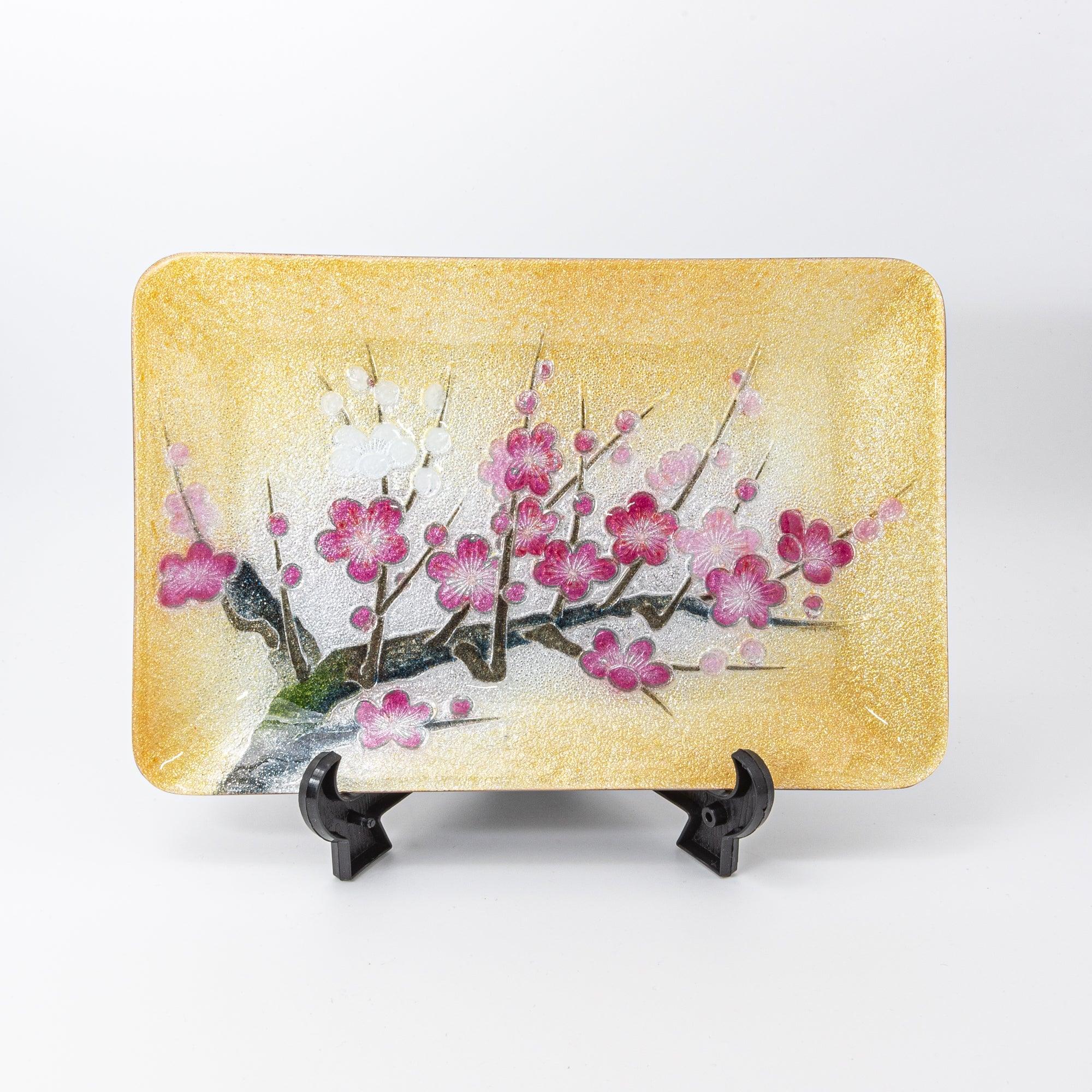 Plum shippo ware gold enamel pen tray on black display stand, front view showing pink and white plum blossom design