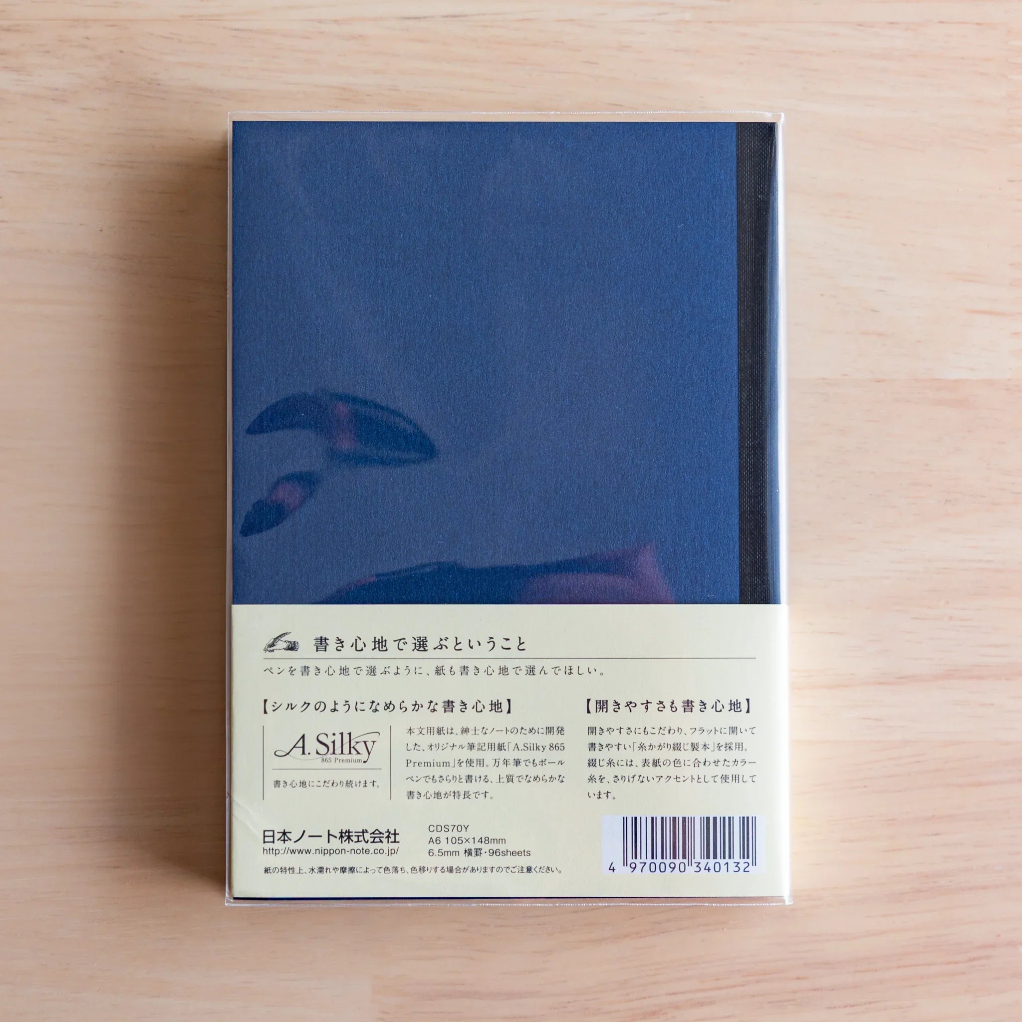 Apica Premium CD Silky notebook closed flat lay on wooden surface Japanese stationery product Japanese premium