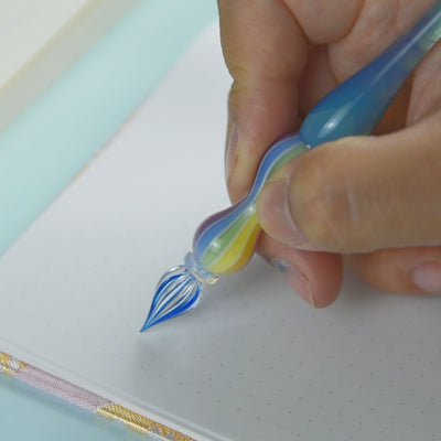 Marin glass balloon dip pen displayed showing multicolored gradient from light teal to deep ocean blue