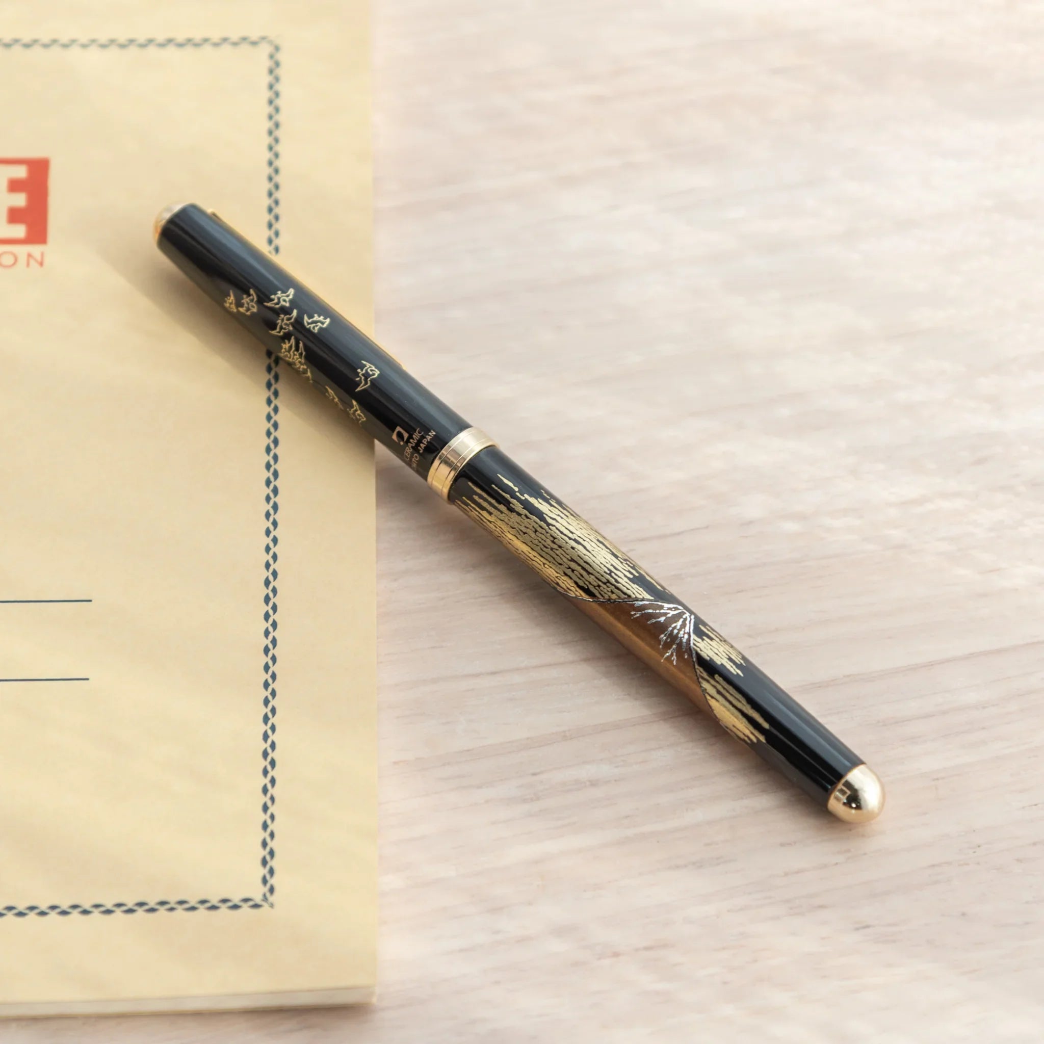 Japanese Yamanaka lacquer ballpoint pen features red Mount Fuji and scenic landscape artwork design made
