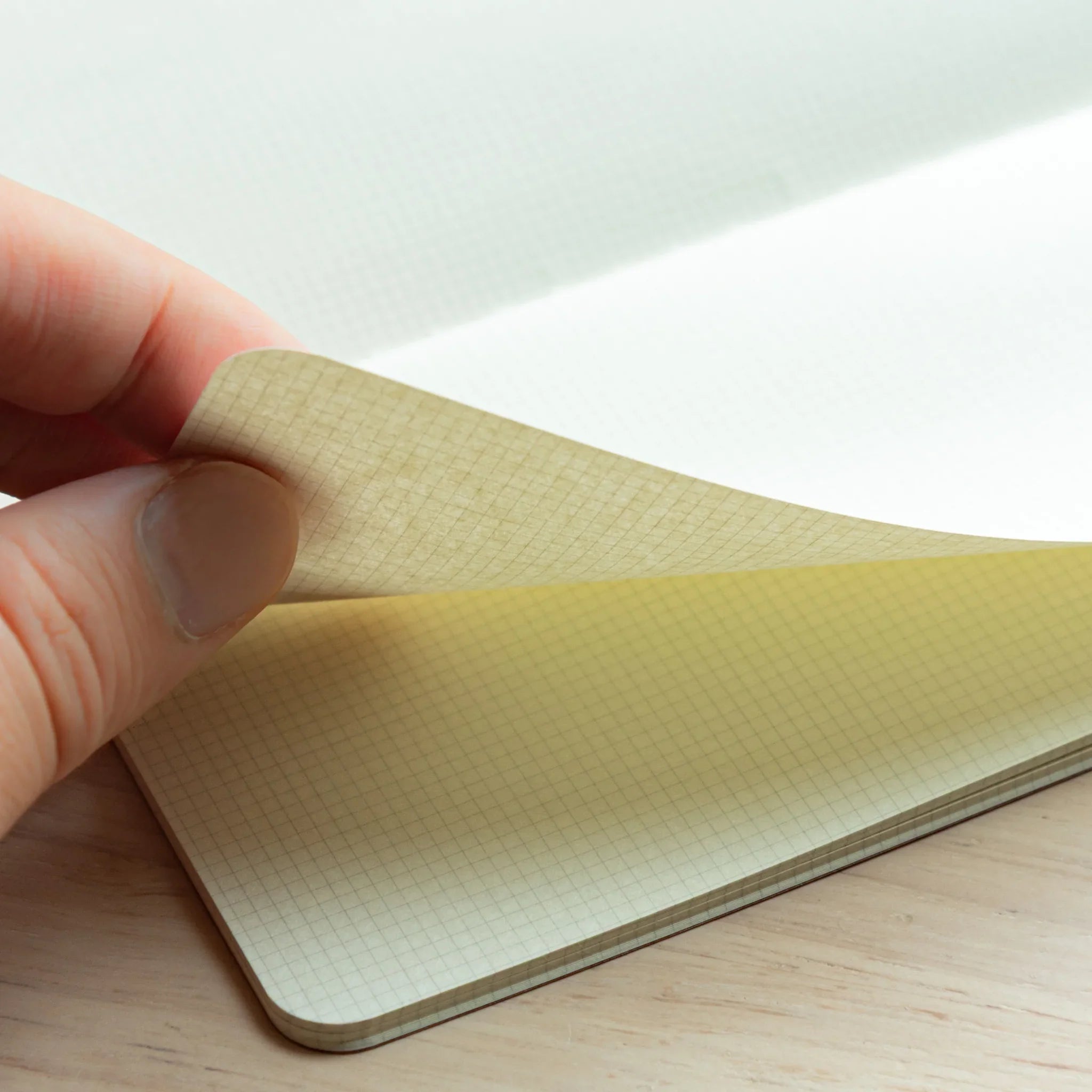 RO-BIKI Basic Series notebook with 2mm grid pattern shown flat on surface, displaying cover design and ruling