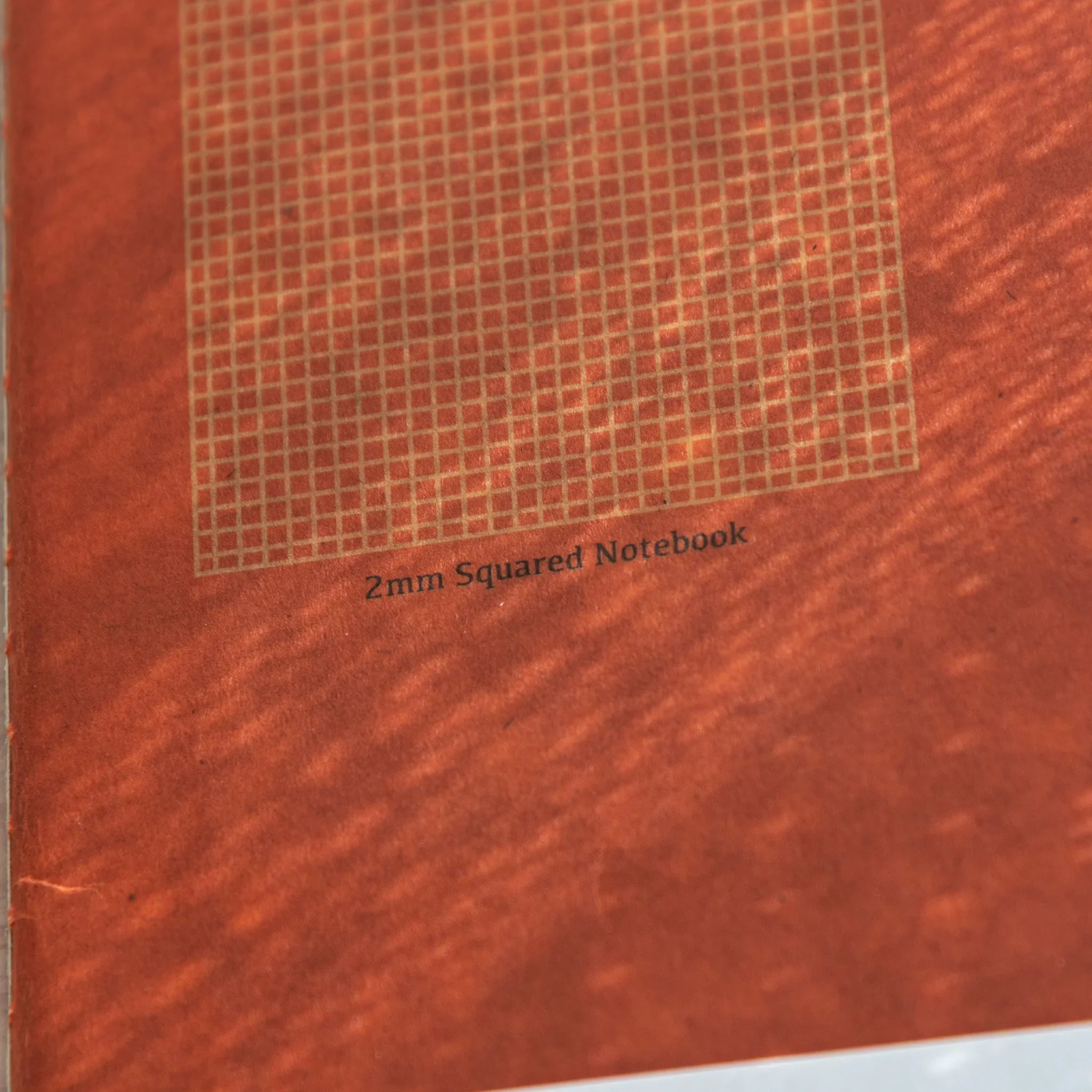 RO-BIKI Basic 2mm grid notebook displayed flat showing slate cover and organized grid pattern, Japanese stationery