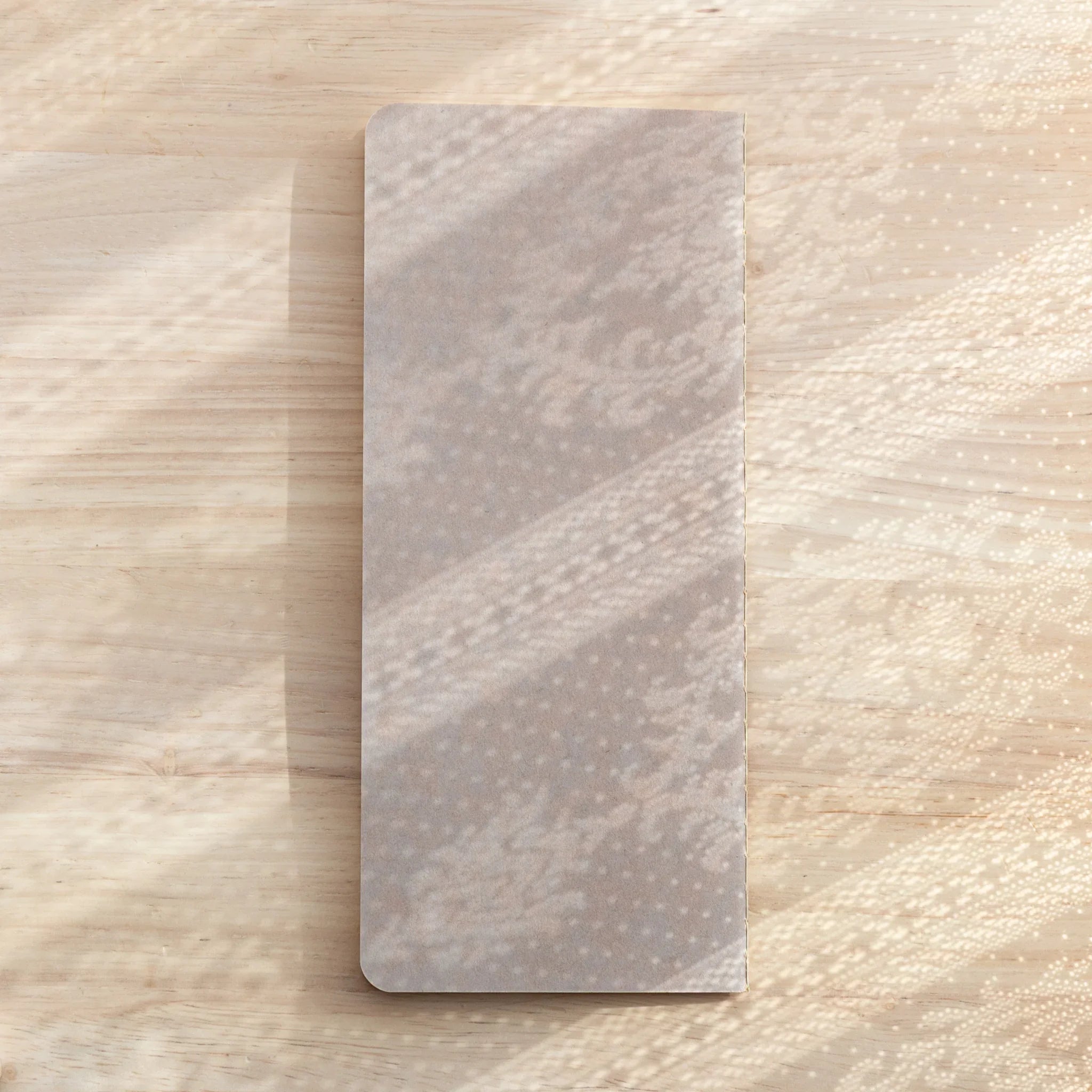 RO-BIKI Basic notebook with 5mm reticle grid displayed flat, showing slate cover and organized grid layout